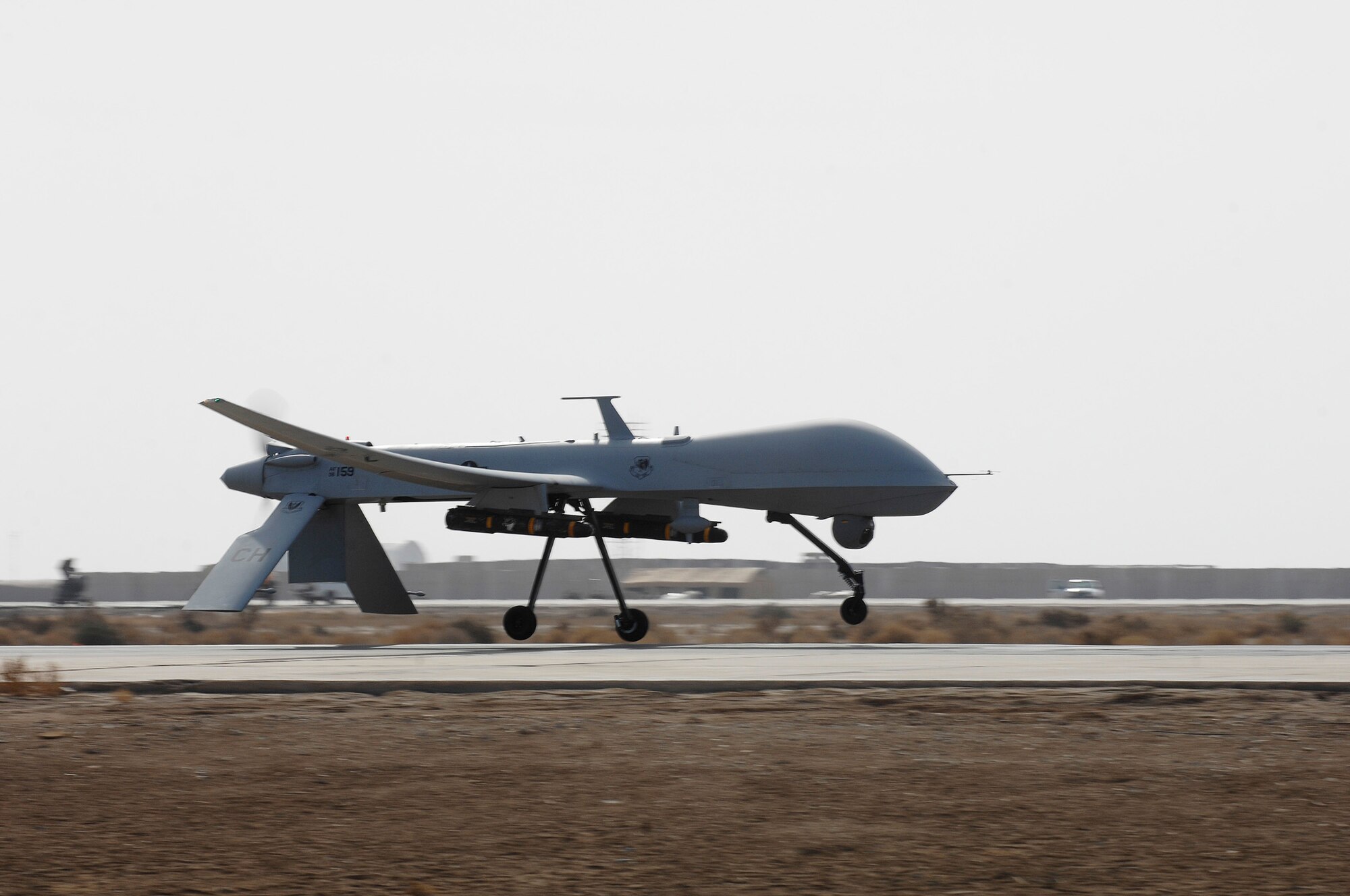 ALI AIR BASE, Iraq -- An MQ-1 Predator Unmanned Aerial Vehicle from the 361st Expeditionary Reconnaissance Squadron takes off Dec. 18 for a mission over Iraq. The Predator is a medium-altitude, long-endurance, remotely piloted aircraft capable of conducting armed reconnaissance against critical, perishable targets. (U.S. Air Force photo/Airman 1st Class Jonathan Snyder)