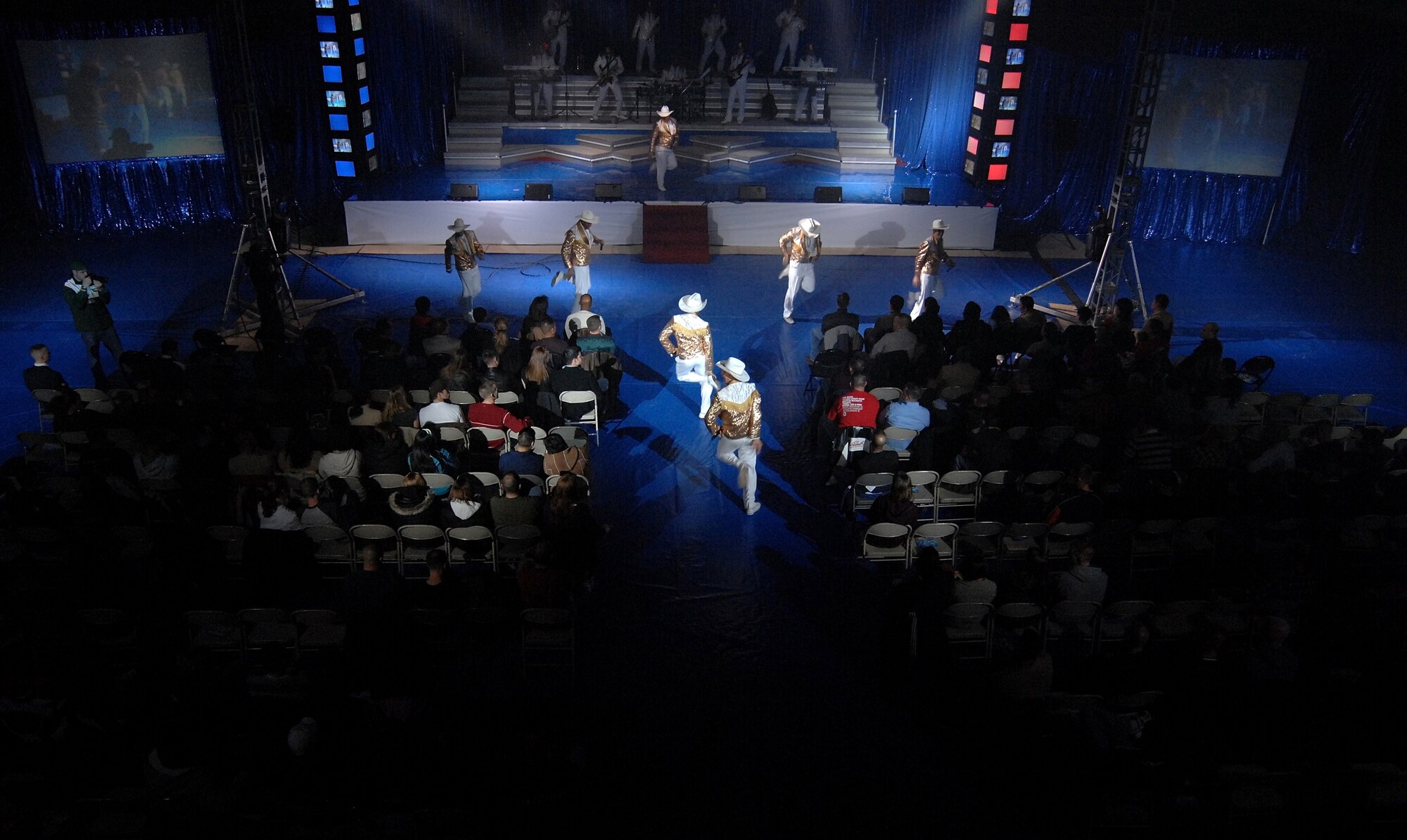 KUNSAN AIR BASE, South Korea -- Tops In Blue members sing and dance during a performance here Dec 23.  The Tops In Blue 2007 tour commemorates the 60th Anniversary of the Air Force and is entitled The Fly By. They performed hits from each decade from 1947-2007. (U.S. Air Force photo/Tech. Sgt. Quinton T. Burris)
