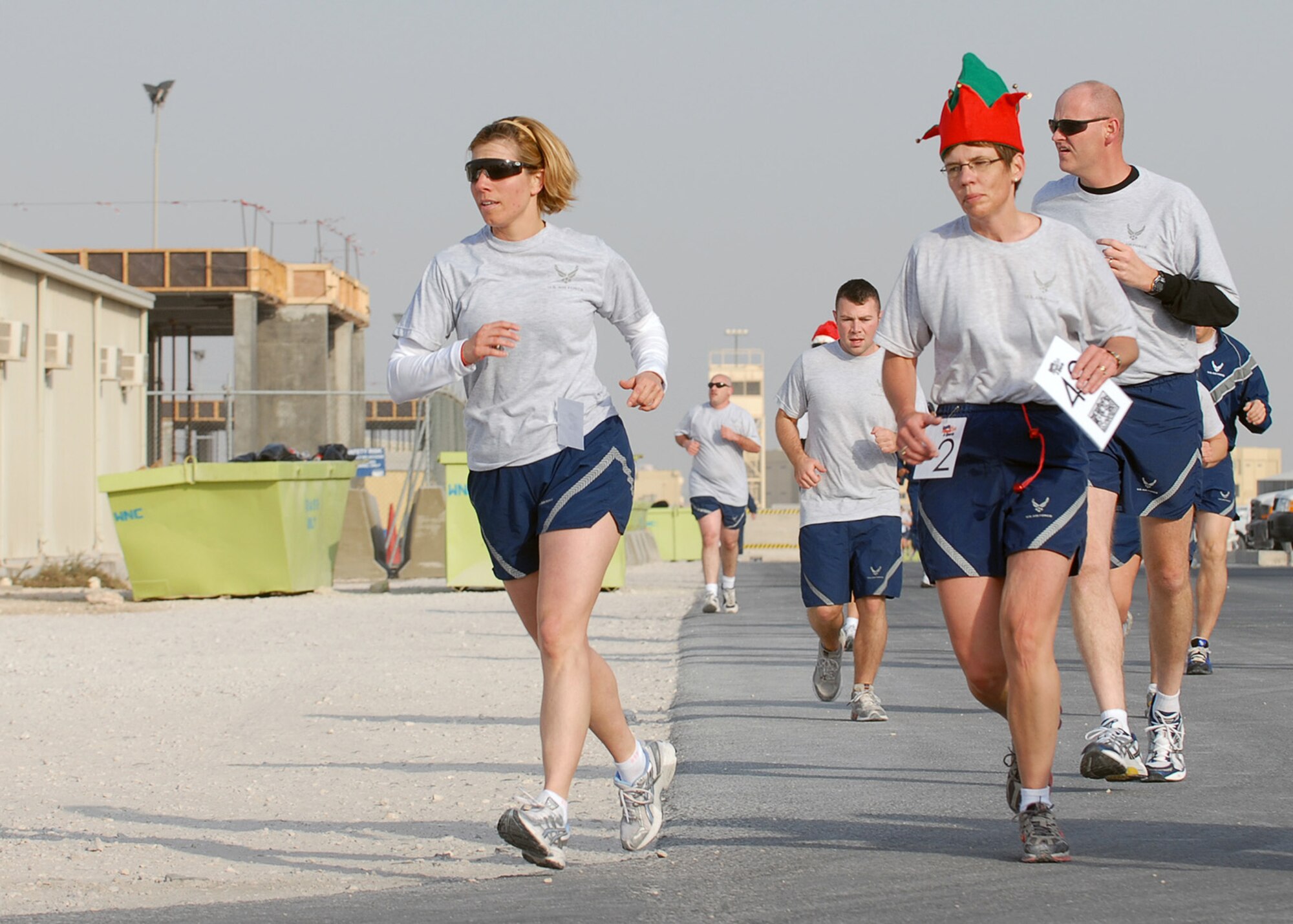 SOUTHWEST ASIA - Lt. Col. Susan Ferrera (left), 379th Expeditionary Services commander, and Master Sgt. Julie Privette, 379th ESVS, participate in a Reindeer Run hosted by the 379th ESVS Dec. 25 at a Southwest Asia air base. (U.S. Air Force photo/Staff Sgt. Douglas Olsen)