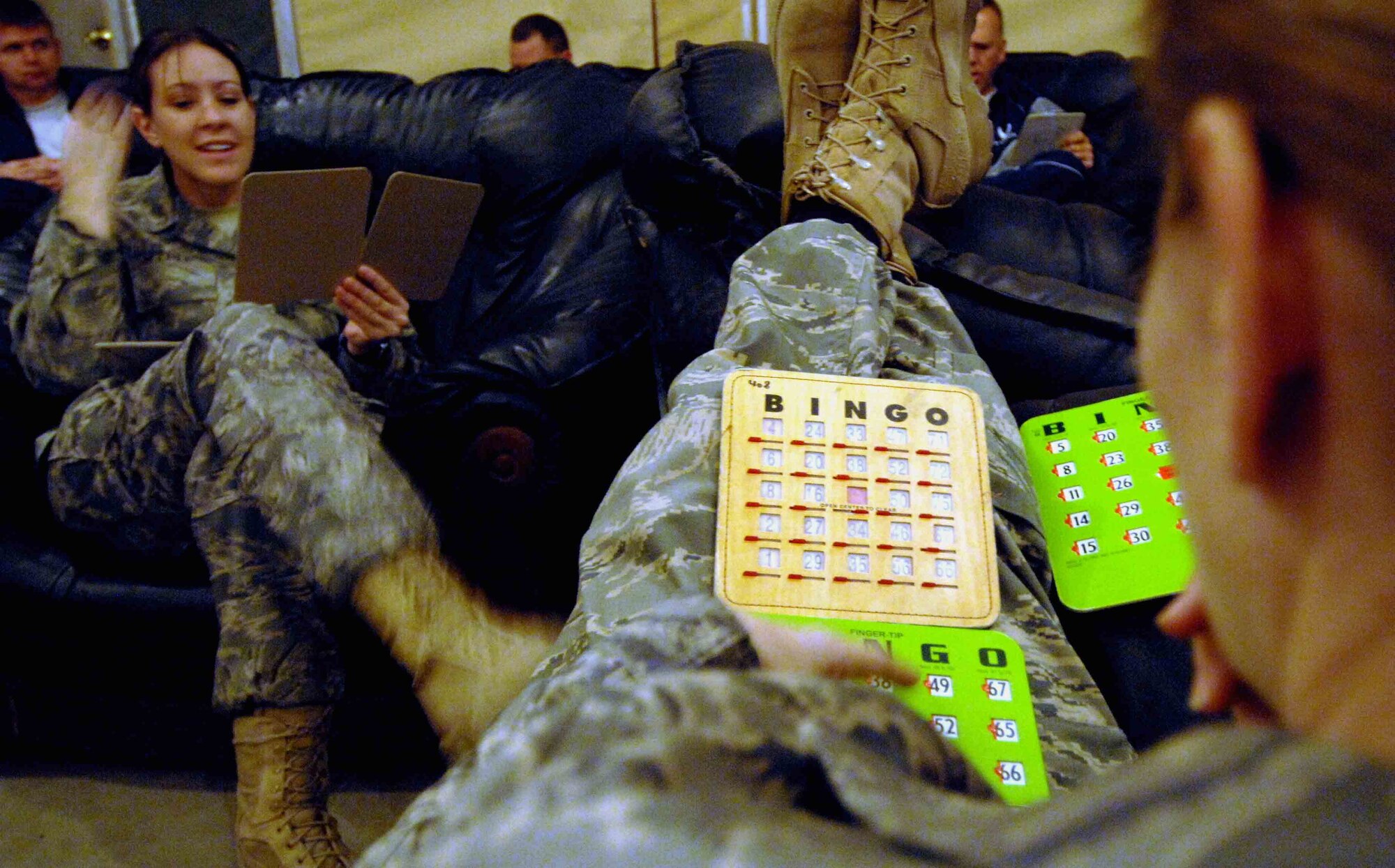 BAGRAM AIR BASE, Afghanistan - 455th Air Expeditionary Wing Airmen here play bingo during a holiday celebration co-sponsored by the 455th Expeditionary Mission Support Squadron, private organizations and volunteers, Dec. 23.  (U.S. Air Force Photo by Capt. Mike Meridith)