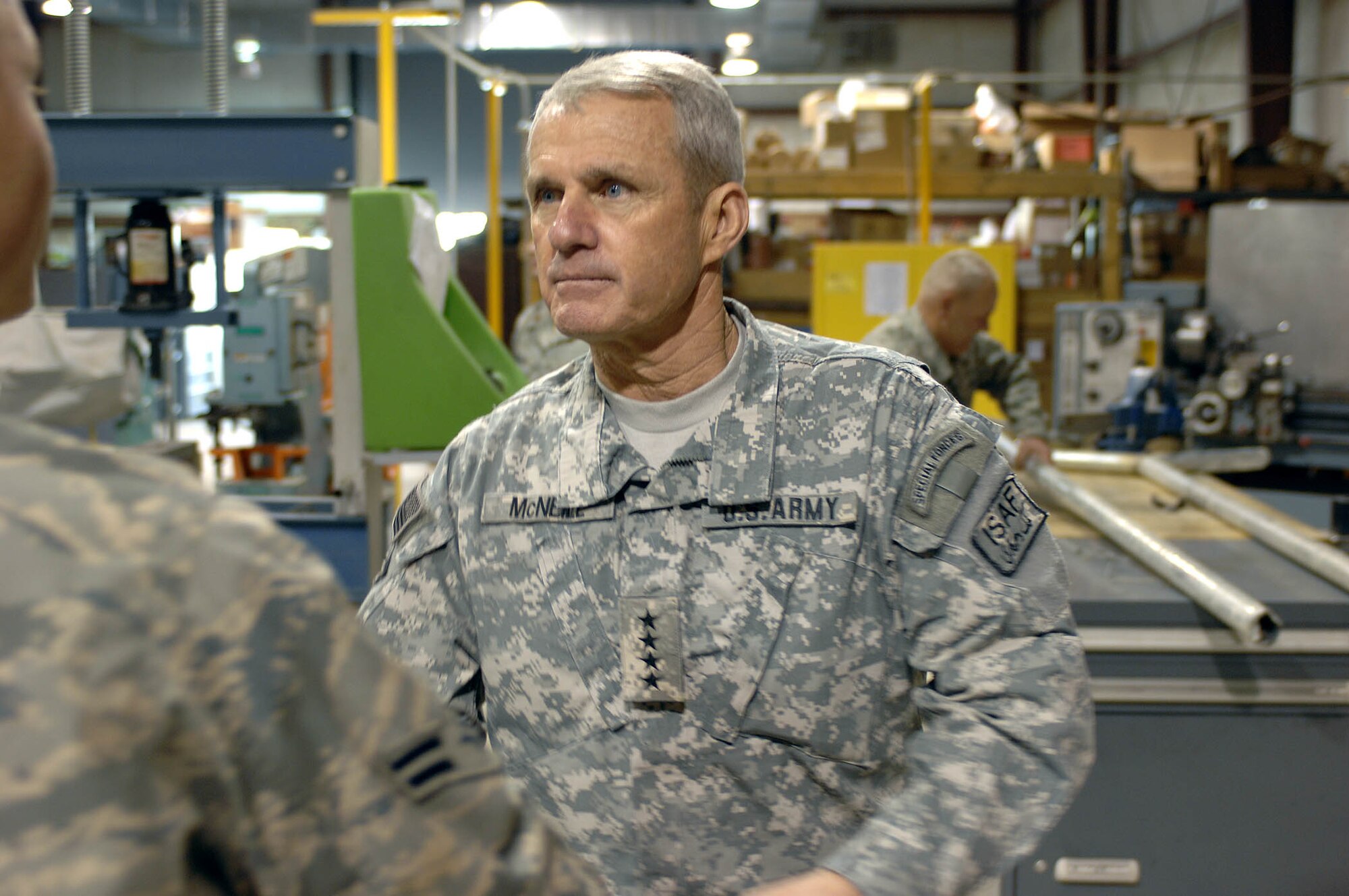 BAGRAM AIR BASE, Afghanistan - Army General Dan McNeill, commander of NATO’s International Security Assistance Force, greets members of the 455th Air Expeditionary Wing here during a surprise Christmas Eve visit.  General McNeill used the visit as an opportunity to thank Airmen for their service and support to ISAF forces throughout Afghanistan.  (U.S. Air Force Photo by Staff Sgt. Mike Andriacco)