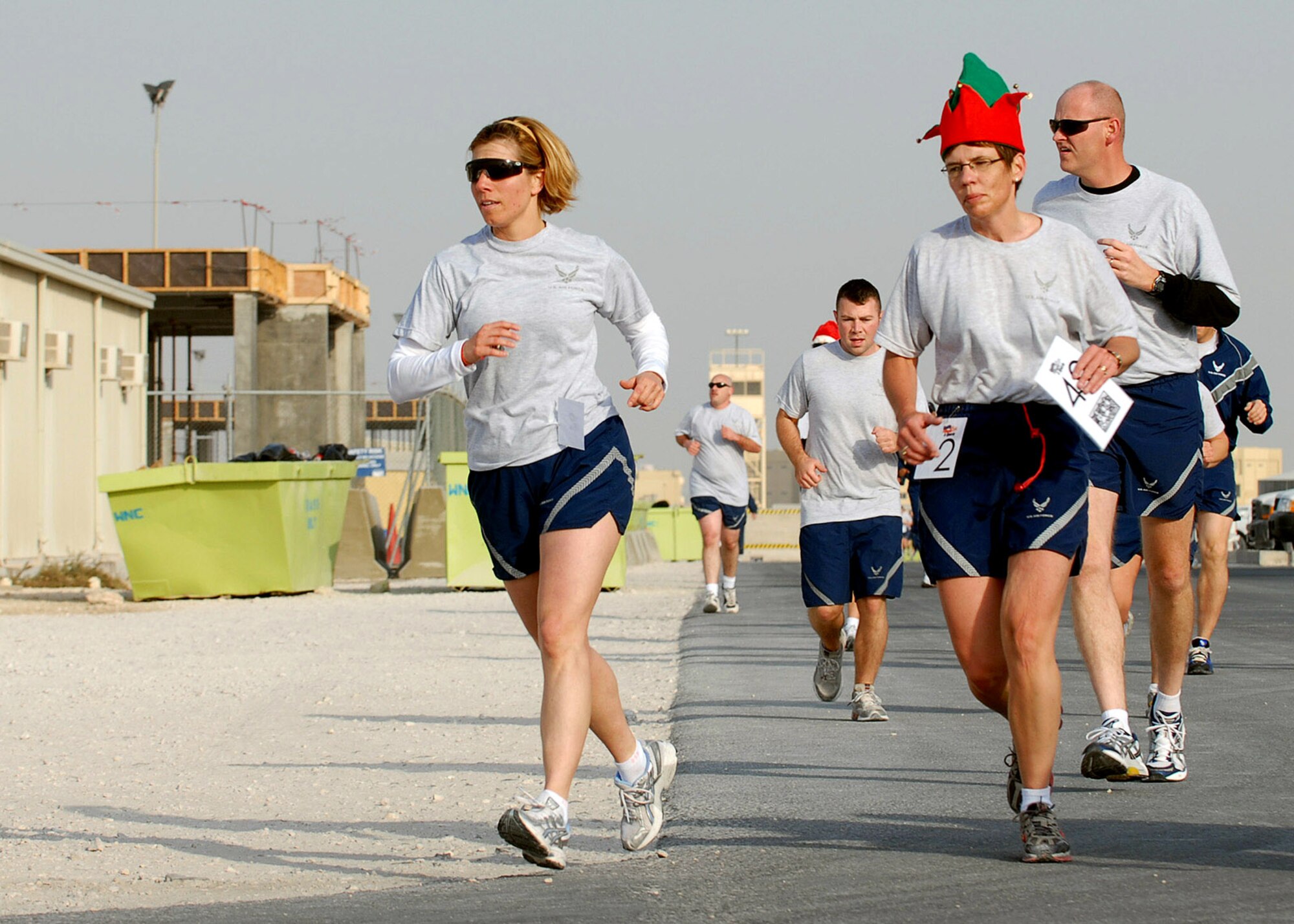 Lt. Col. Susan Ferrera (left) and Master Sgt. Julie Privette participate in a Reindeer Run Dec. 25 at a Southwest Asia air base. Colonel Ferrera is the 379th Expeditionary Services commander, and Sergeant Privette is assigned to the 379th ESVS. (U.S. Air Force photo/Staff Sgt. Douglas Olsen) 
