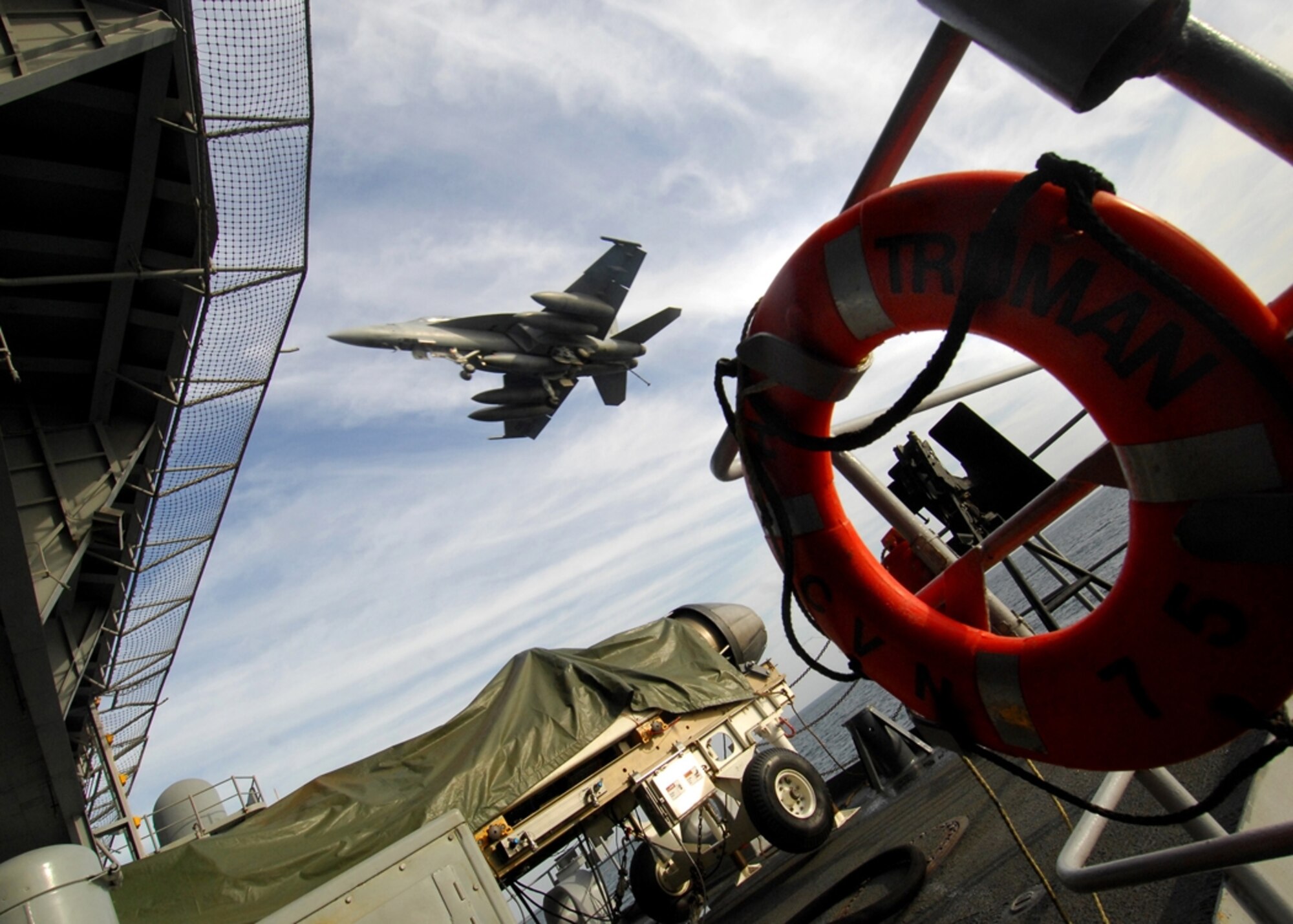 ARABIAN GULF – An F/A-18 Hornet prepares to land on the flight deck of the Nimitz-class aircraft carrier USS Harry S. Truman.  The Truman and embarked Carrier Air Wing 3 are underway on a deployment in support of Operations Enduring and Iraqi Freedom.  (U.S. Navy photo by Mass Communication Specialist 3rd Class Ricardo J. Reyes, Released)
