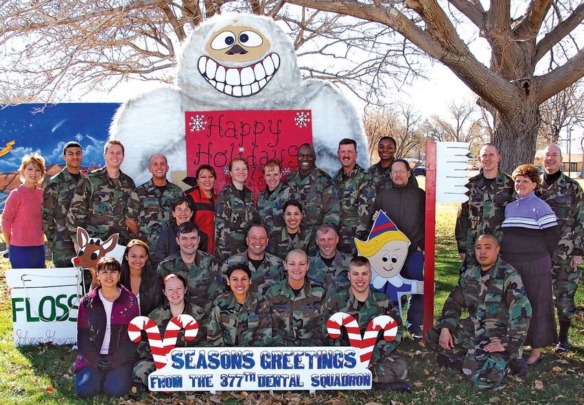 The 377th Dental Squadron was selected as the "Medium Dental Clinic of the Year." Col. John Paul, dental squadron commander, said they were awarded a 94 percent score on their Air Force level three-year inspection, which is the equivalent to the ORE. "I am really proud of these guys," said Colonel Paul. Superintendent Senior Master Sgt. Robert Lowery said that the three attributes that won them this honor was focus, vision and purpose. This is only a representative of the 32 members of the Kirtland AFB 377th Dental Squadron. U.S. Air Force photo by Todd Berenger
