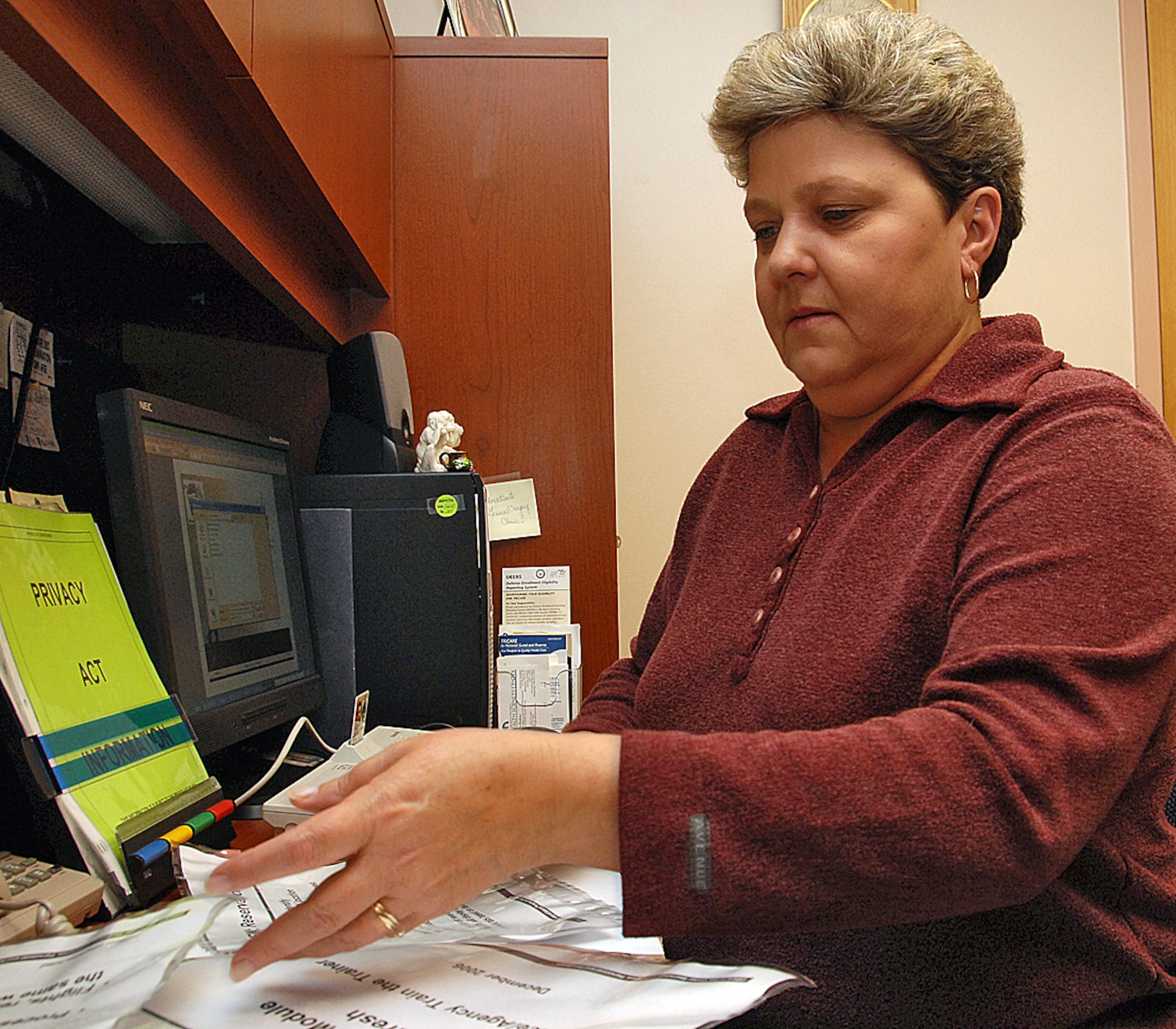 Mary Devinney was selected as the "Outstanding Health Plan Management Civilian of the Year." Mrs. Devinney said, taking the time to look at insurance claims being processed and looking out for any problems was the key to winning the award. U.S. Air Force photo by Todd Berenger

