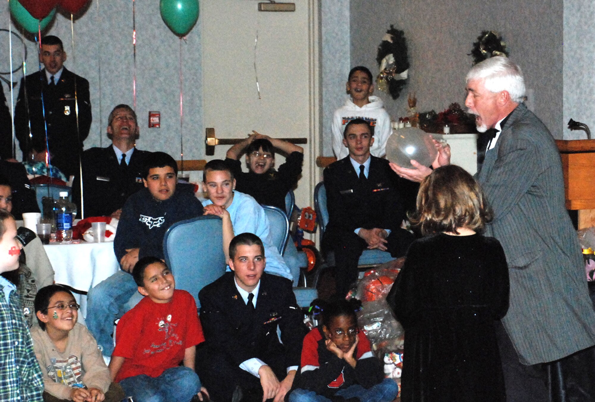 Jeff Thompson entertains children with a magic show during Operation Provide Joy at the Trail’s End Club Dec. 15. More than 90 local children attended the event sponsored by the Salvation Army and hosted by Warren. OPJ was created to give underprivileged children the chance to celebrate the holidays.
