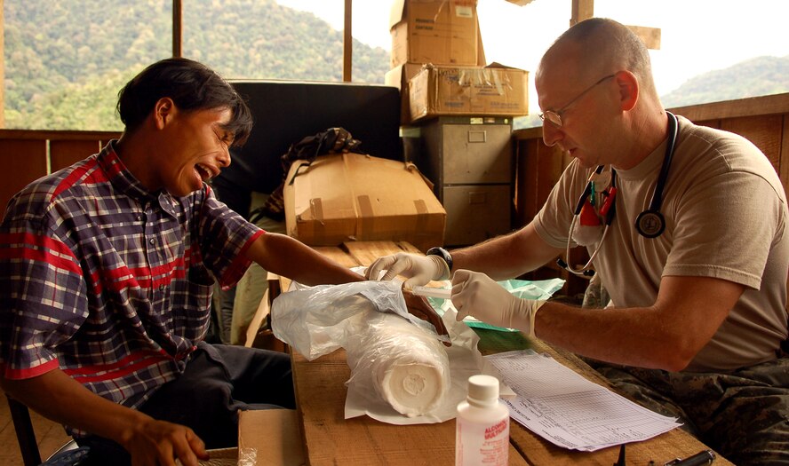 Army Col. (Dr.) Stephen Bernstein administers a shot to a native Costa Rican man at a makeshift clinic Dec. 18 at Piedra Mesa, Costa Rica. Colonel Bernstein is assigned to the Joint Task Force-Bravo medical element. JTF-Bravo deployed 28 servicemembers from Soto Cano Air Base, Honduras, to Costa Rica at the invitation of the country's ministry of health for a medical readiness training exercise. (U.S. Air Force photo/Staff Sgt. Austin M. May) 