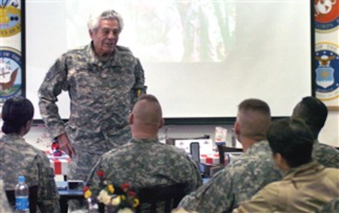 Retired Army Lt. Col. James Megellas, a World War II veteran, talks to staff personnel during a class on leadership at the Joint Operations Center on Bagram Airfield, Afghanistan, Dec. 24, 2007.  Megellas chronicled his time in the 82nd Airborne Division's 504th Parachute Infantry Regiment in his book, “All the Way to Berlin.”
