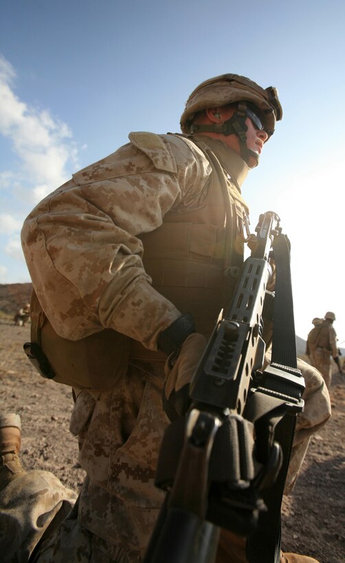 Cpl. David A. Claypool, a field radio operator with 2nd Platoon, Alpha Battery, 3rd Low Altitude Air Defense Battalion, scans the horizon for potential targets before ordering his Marines forward during a fire a movement exercise at Range TC-11 Dec. 26. 3rd LAAD is a part of the Combined Joint Task Force-Horn of Africa mission, which is to prevent conflict, promote regional stability and protect coalition interests in order to prevail against extremism.