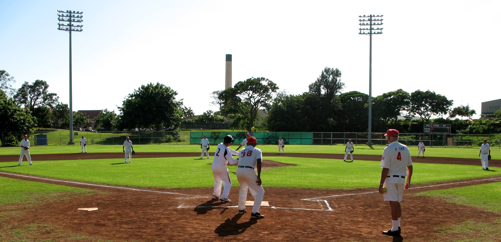 The Kids & Kubs senior softball team from St. Petersburg, Fl., and the Over the Rainbows senior softball team from Japan play a friendly game at Hans L'Orange Park in Waipahu, Hawaii Dec. 19. The two teams, comprising WWII veterans, met here to make peace with the past and play this historic game. The Kids & Kubs won the game 14-2. (U.S. Air Force photo/Tech. Sgt. Chris Vadnais)