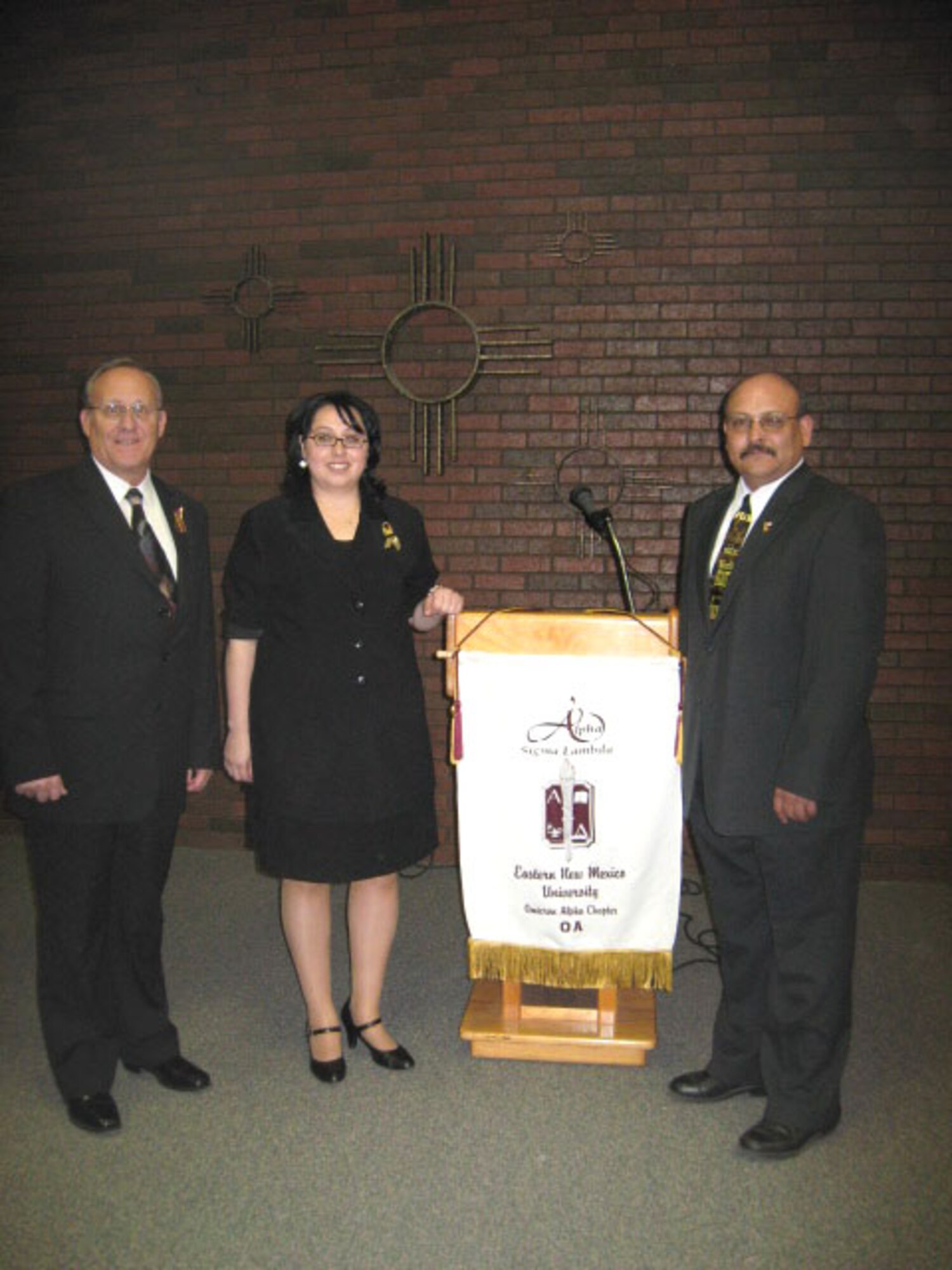 CANNON AIR FORCE BASE, N.M. -- Jim Laquerre, 27th Special Operations Services Squadon deputy commander (left), who was the guest speaker at the induction ceremony for the Omicron Alpha Chapter of Alpha Sigma Lambda at Eastern New Mexico University in Portales, N.M., was surprised by himself being inducted into the honor society for nontraditional students Dec. 7. He was inducted by Joe Lafuente, 27 SOSVS, who founded and is president of the chapter and Esthela Banuelos, ENMU's national councilor to the honor society. (courtesy photo)
