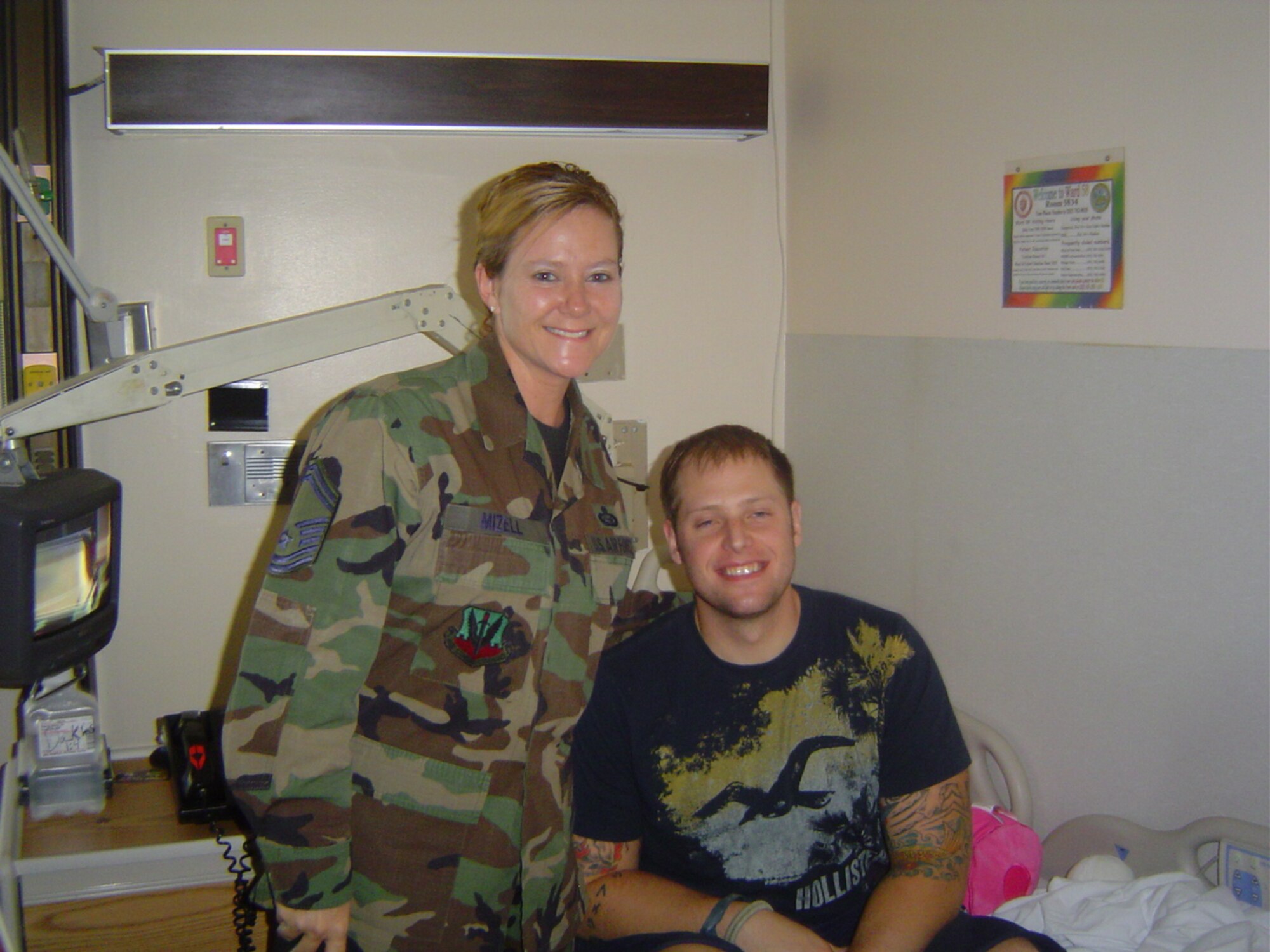 SMSgt Paula Mizell, CONR-1AF (AFNORTH)/CCP, visits with a U.S. Soldier recuperating at Walter Reed Medical Center, Washington D.C.  The soldier was injured in Iraq when his convoy was hit by an IED attack.  During his 18 months at Walter Reed this soldier has undergone over 20 surgeries to repair a severe leg injury.