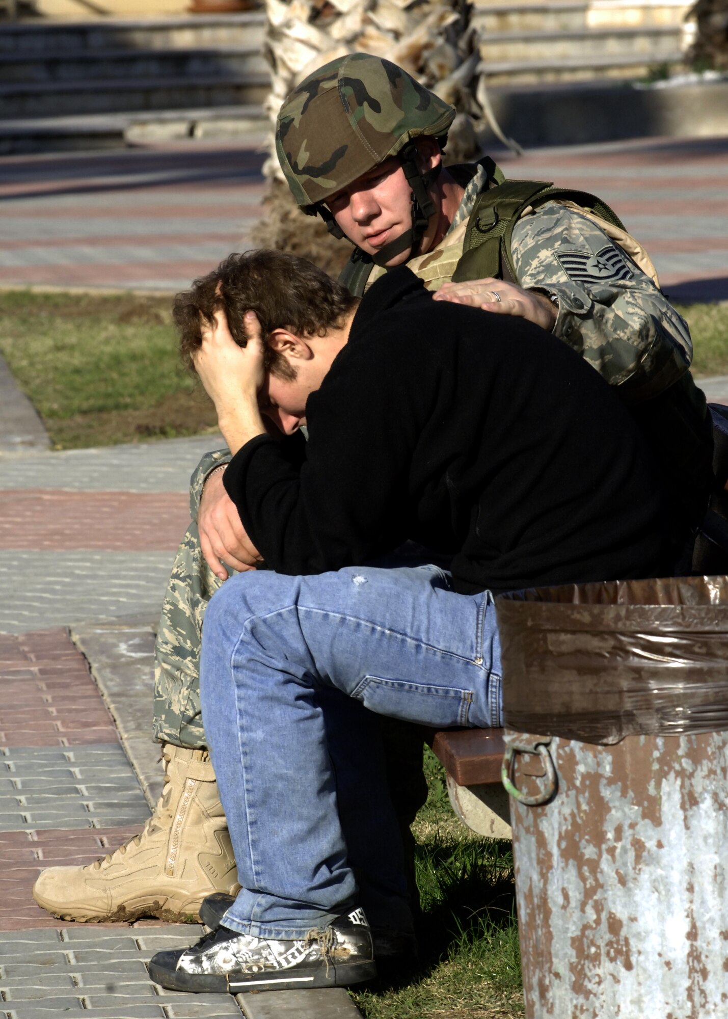 Tech. Sgt. Randolph Hodson, 39th Security Forces Squadron Law Enforcement supervisor, calms Justin Nalley, a senior at Incirlik Unit High School during a Mass Accident Response Exercise, held on the school grounds Dec. 17. The MARE not only tested the 39th Air Base Wing’s Ability to respond to those physically injured, but also those suffering from mental distress after a mass accident. (U. S. Air Force photo by Airman 1st Class Nathan Lipscomb)