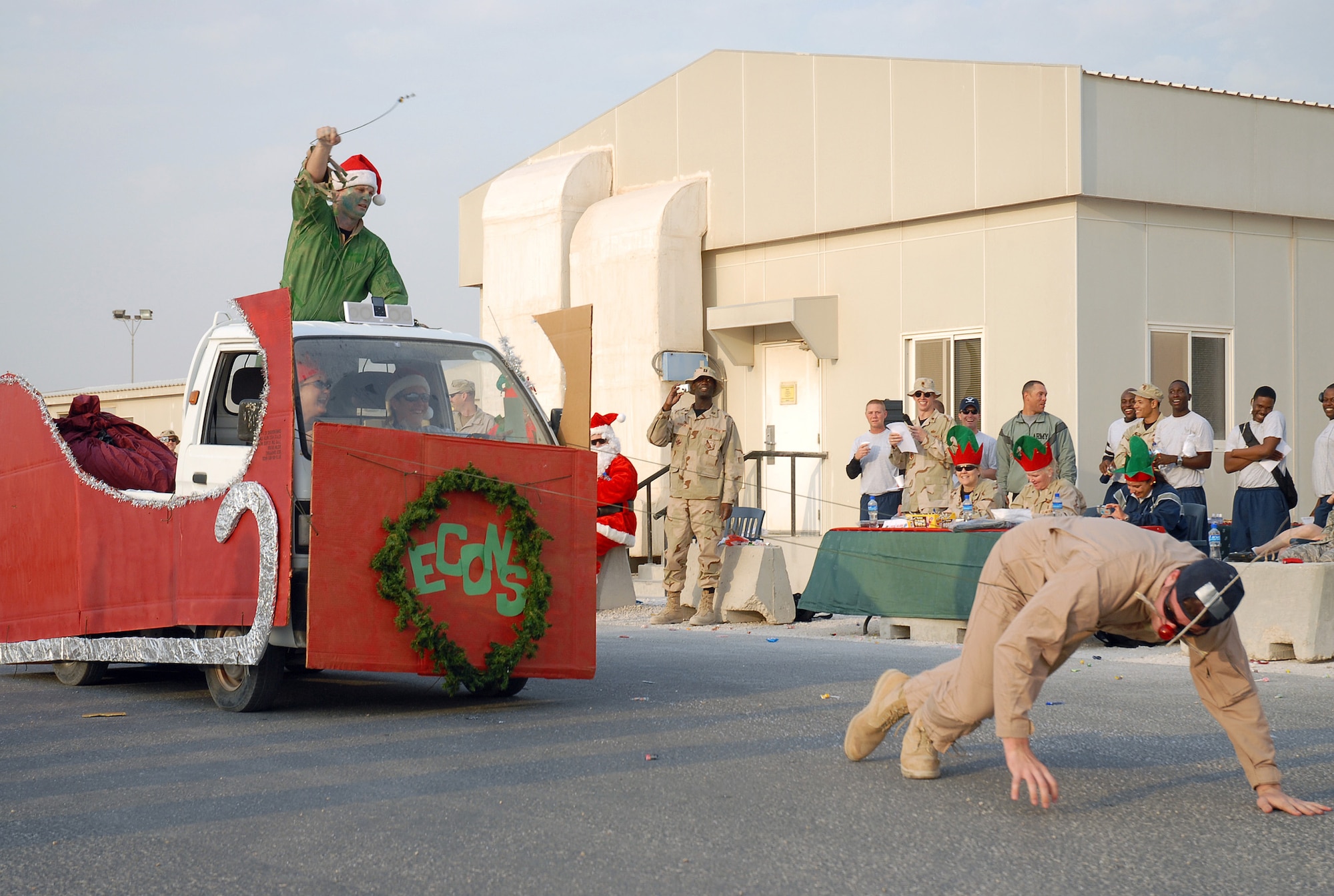 SOUTHWEST ASIA - Various squadrons and tenant units of the 379th Air Expeditionary Wing participated in the Christmas Day Parade at a Southwest Asia air base Dec. 25. The floats ranged from Daewoos decorated like sleighs to fuel trucks being pulled by reindeer. (U. S. Air Force photo/Staff Sgt. Douglas Olsen)