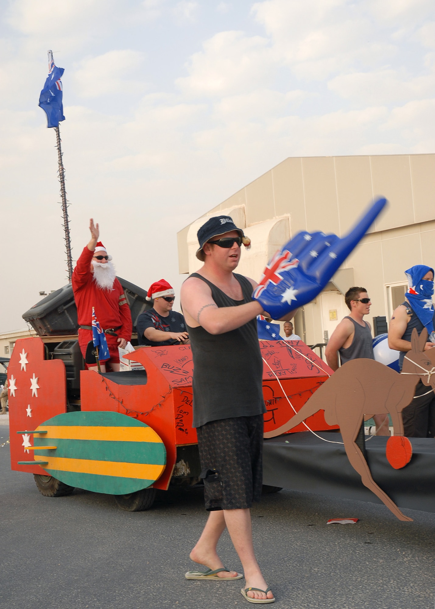 SOUTHWEST ASIA - Various squadrons and tenant units of the 379th Air Expeditionary Wing participated in the Christmas Day Parade at a Southwest Asia air base Dec. 25. The floats ranged from Daewoos decorated like sleighs to fuel trucks being pulled by reindeer. (U. S. Air Force photo/Staff Sgt. Douglas Olsen)