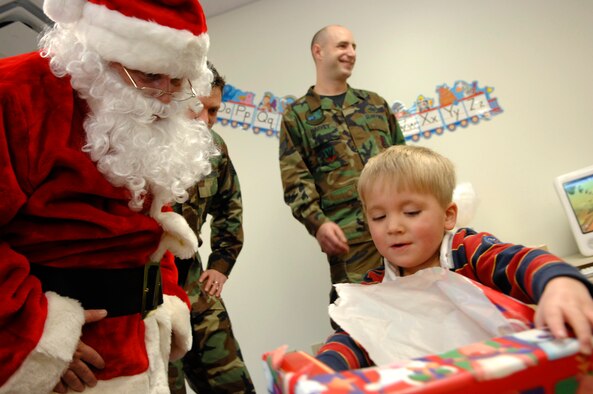 The Gryphon Unit Advisory Council of the 28th Operations Squadron sponsored an Angel Tree gift program for the Youth and Family Services Child Care center in Rapid City, S.D., Dec. 20. Students received many varieties of gifts due to the generosity of active duty members and their families. (U.S. Air Force photo/ Staff Sgt. Michael B. Keller) 

