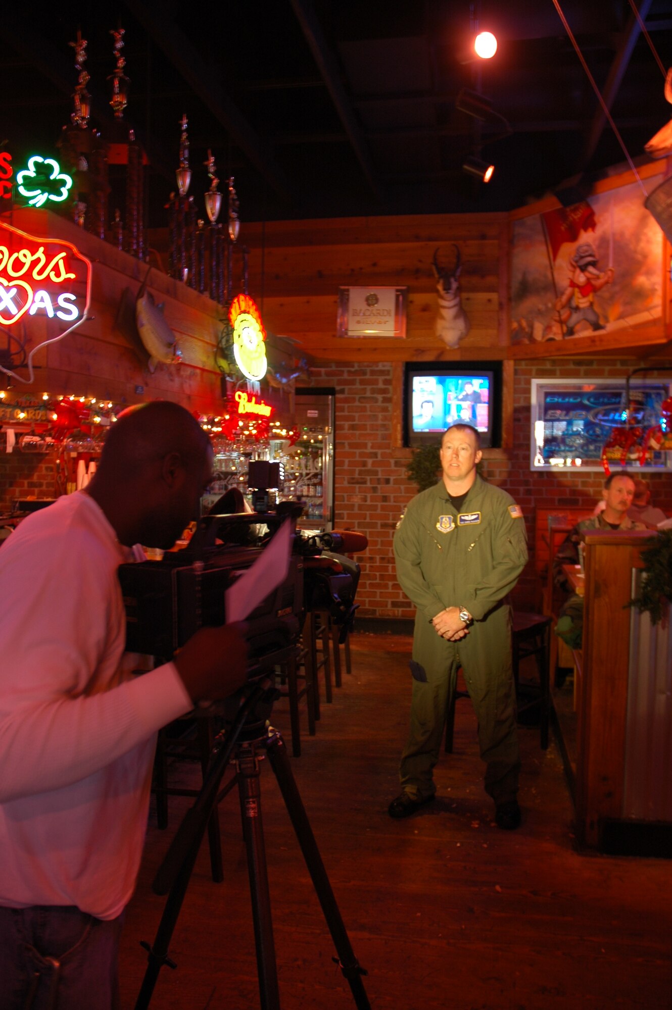 Tech. Sgt. David Peacock, 315th Aeromedical Evacuation Squadron medical technician, is interviewed by local channel 2 news station at the Texas Roadhouse in North Charleston, December 28. The restaurant donated $1500 of gift cards for Reservists returning from deployment. (photo by Capt. Bryan Lewis, USAFR)