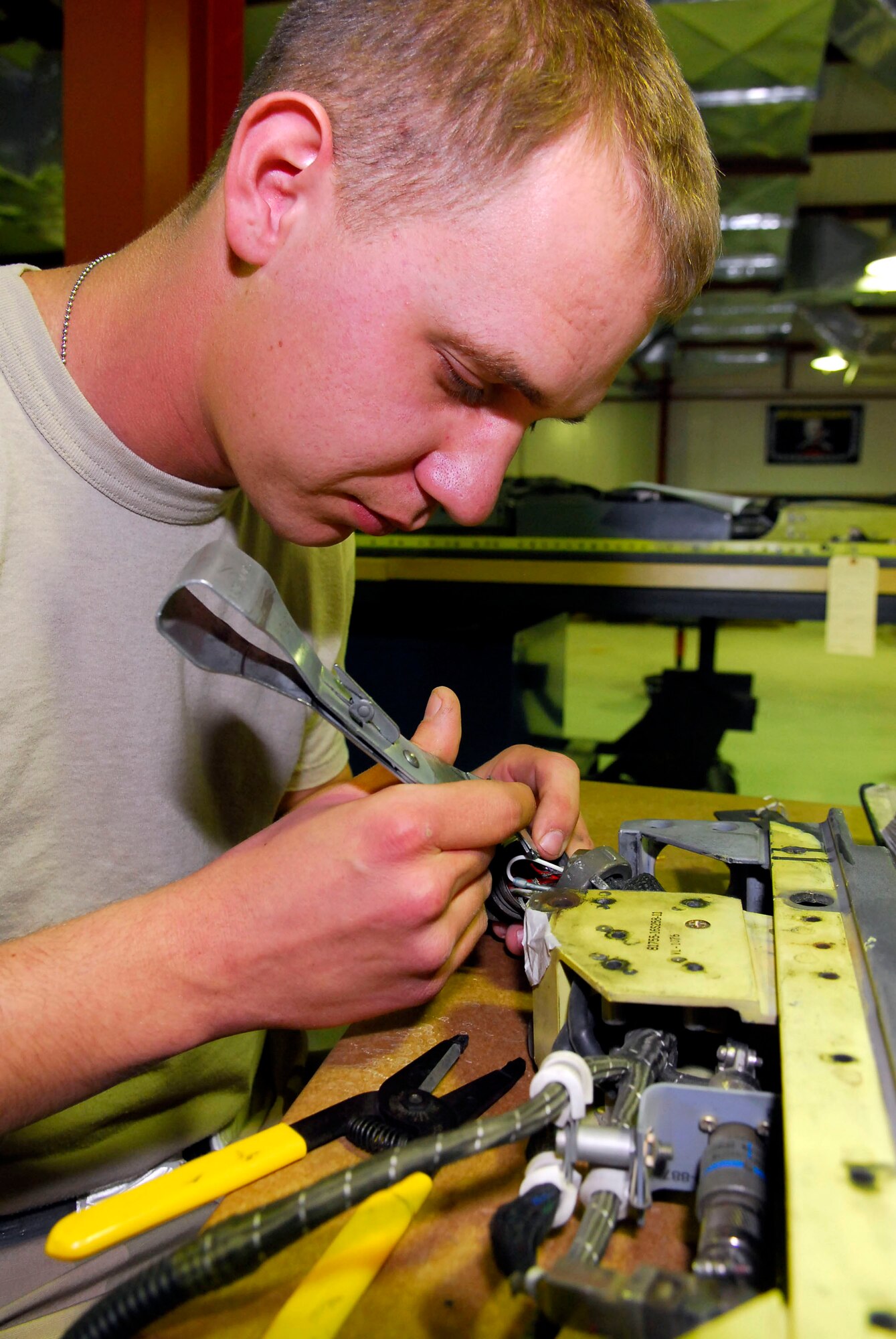 Airman 1st Class Chris Puzan fixes discrepancies found on a S2-10 missile launcher during an inspection Dec. 28 at Balad Air Base, Iraq. Missile launcher inspections ensure that the armament systems are in working order. Airman Puzan, a 332nd Expeditionary Maintenance Squadron armament systems technician, is deployed from Spangdahlem Air Base, Germany. (U.S. Air Force photo/Staff Sgt. Joshua Garcia) 
