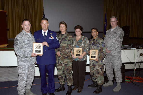 (Above) Wing chief master sergeants held a unique series of award ceremonies Dec. 1-2, where each chief selected an individual to recognize for going above and beyond in the workplace. Each chief chose a wing member and personally purchased each of their Chief's Awards to give to the recipients. The award sponsors and recipients were (left to right) Chief Master Sgt. Rocky Hart and Master Sgt. David Griffith, Chief Master Sgt. Pamela Duvall and Karen Shope, and Tech. Sgt. Oswaldo Roman and Chief Master Sgt. Jeffrey Fitzpatrick. (U.S. Air Force Photo/Mike Fleck)