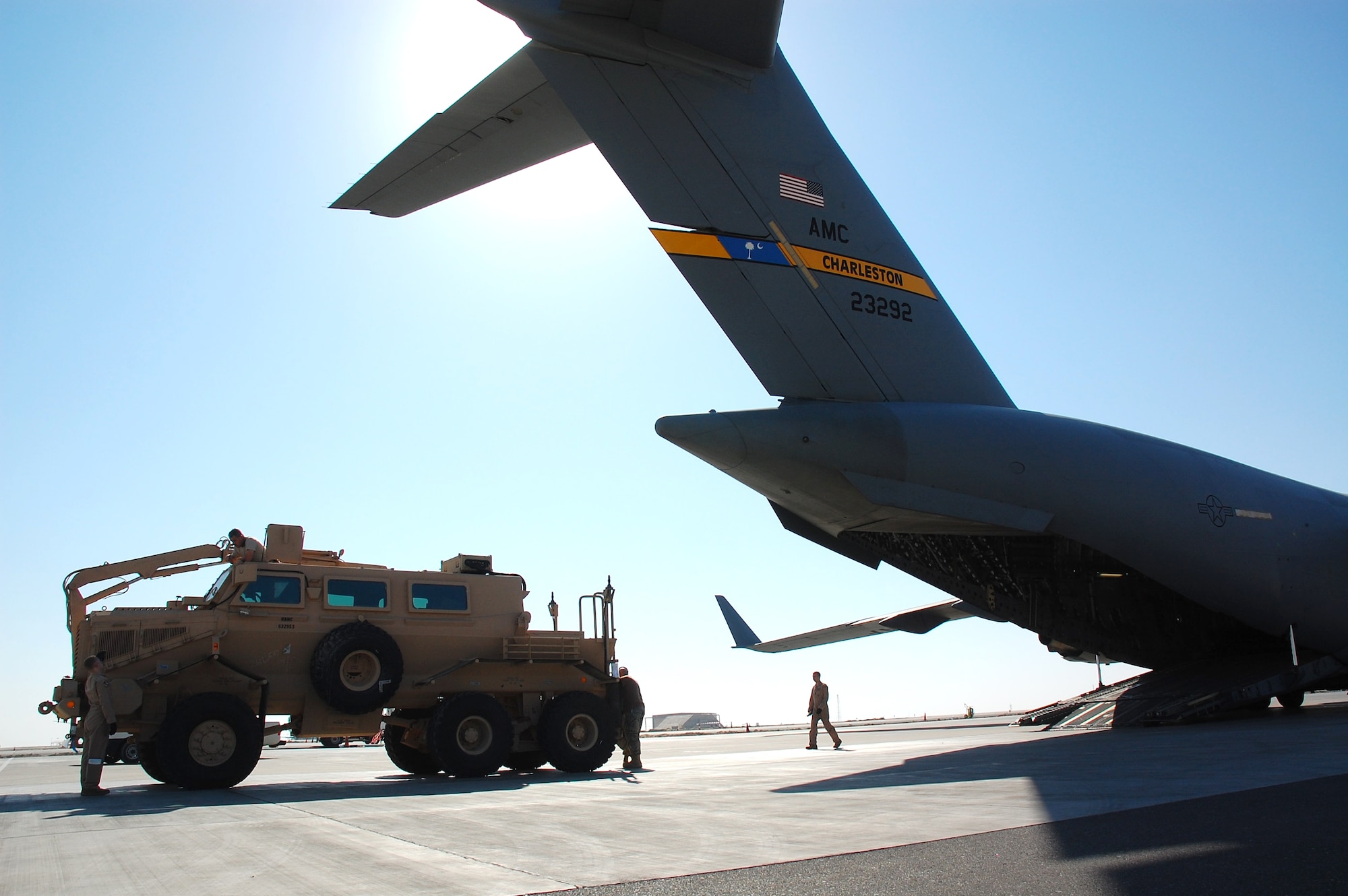 SOUTHWEST ASIA -- Airmen from the 386th and 379th Air Expeditionary Wings load a Mine Resistant Ambush Protected vehicle onto a C-17 Globemaster III from Charleston AFB, S.C., Dec. 28.  The MRAP was heading to Iraq and is designed to help protect military members from mines and improvised explosive devices.  The C-17's aircrew members are from McGuire AFB, N.J. and currently deployed to an air base in the Middle East.  (U.S. Air Force photo/Staff Sgt. Tia Schroeder)