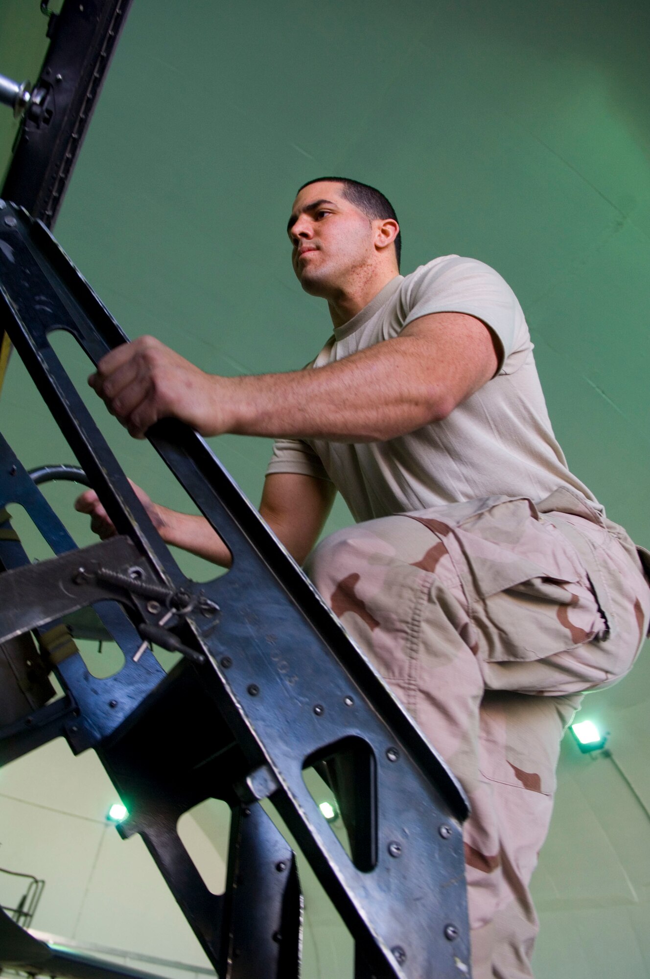 BALAD AIR BASE, Iraq -- Senior Airman Ulises Varela, a 332nd Expeditionary Maintenance Squadron aircrew egress technician, climbs into the cockpit of an F-16 here, Dec. 28. Airman Varela then raised the ejection seat as part of the Fighting Falcon’s phase inspection. Airman Varela is deployed from Hill Air Force Base, Utah. (U.S. Air Force photo/Staff Sgt. Travis Edwards)