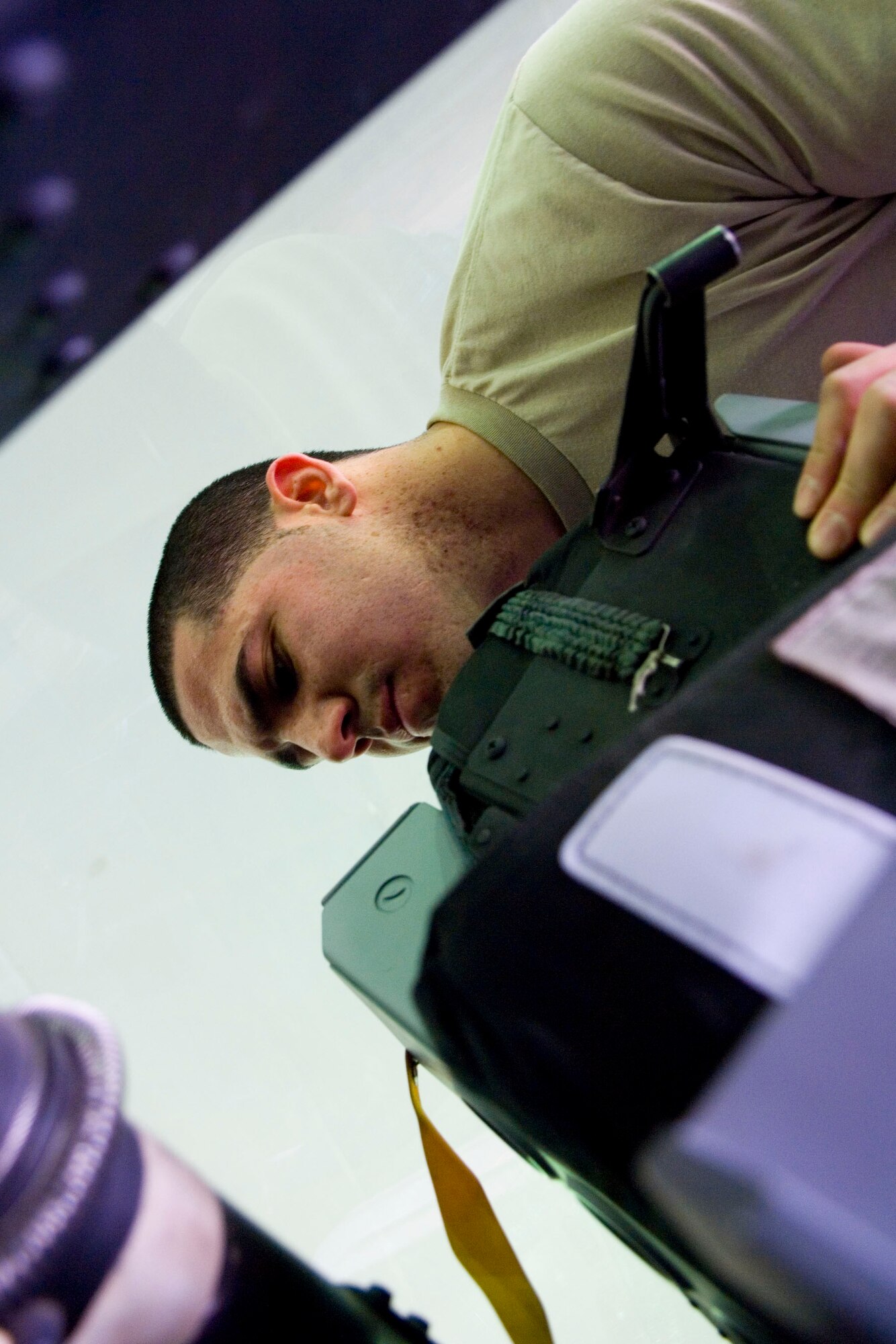 BALAD AIR BASE, Iraq -- Senior Airman Ulises Varela, a 332nd Expeditionary Maintenance Squadron aircrew egress technician, checks behind an F-16 Fighting Falcon cockpit ejection seat to ensure all loose wires are out of the way and secure. Raising the ejection seat to check for debris is part of a phase inspection that happens every 400 flying hours. Airman Varela is deployed from Hill Air Force Base, Utah. (U.S. Air Force photo/Staff Sgt. Travis Edwards)