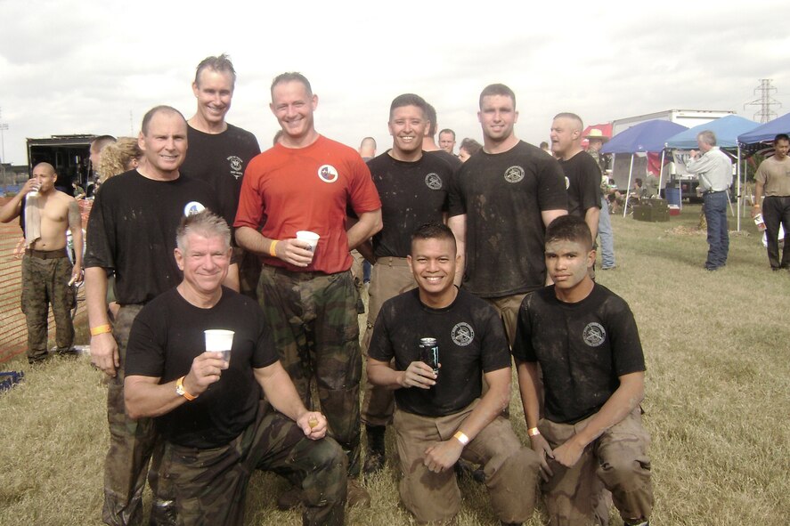 The 2007 Mud Run had many 301st Fighter Wing members covered in, well, mud. Col. Max Mendoza's team from the 301st Mission Support Group, MSG Warriors, included his son, Jonathon, Master Sgt. Jerry Munoz, and Senior Master Sgt. Scott Lacey (not pictured here). Joining in the fun were the Spad Fossils consisting of two colonels and a two generals: Maj. Gen. Jim Sluder, Brig. Gen. Craig Gourley, Cols. Francis Zuconni and Tommy Williams. All Spad runners are past and present members of the 457th Fighter Squadron. The Warriors placed sixth in the uniformed division with the Fossils coming in 13th out of 20 teams. (U.S. Air Force Photo)