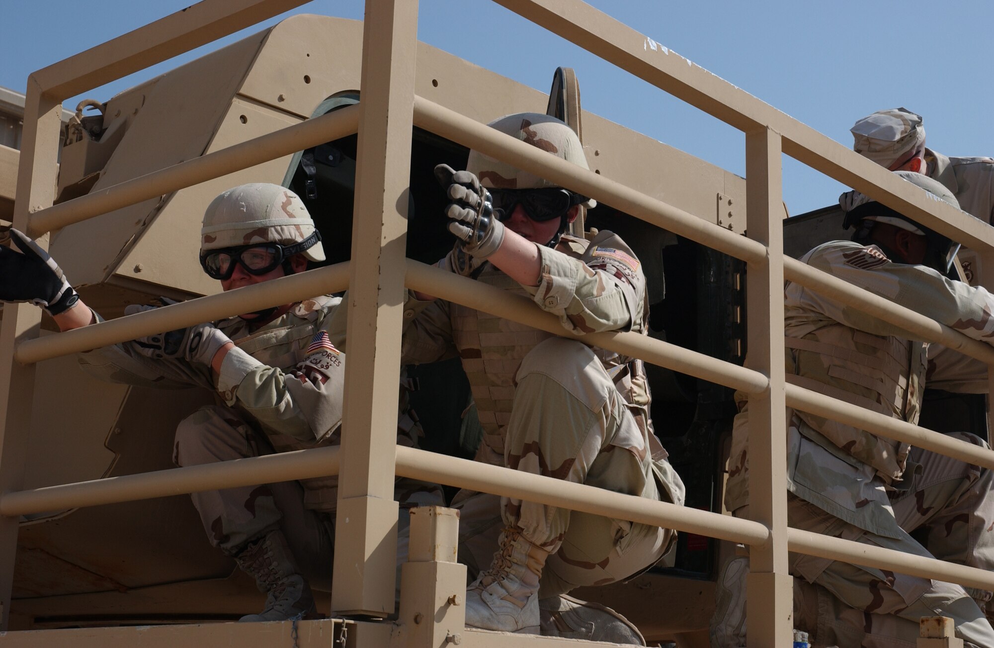 SOUTHWEST ASIA - Members of the 379th Expeditionary Security Forces safely egress the vehicle and take their positions to secure the perimeter against the enemy during the High Mobility Multi-purpose Wheeled Vehicle (HMMWV) Egress Assistance Training at an Army camp in Southwest Asia recently. (U.S. Air Force photo/Staff Sgt. Doug Olsen)