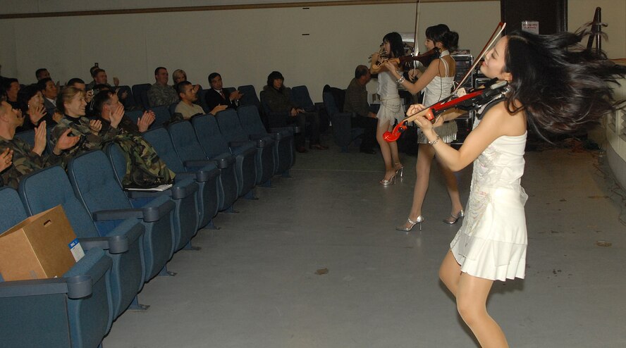 KUNSAN AIR BASE, South Korea -- The Jung Ah performance group from Busan City performs for Airmen here Dec. 28.  The group performed as part of Kunsan’s Good Neighbor Program and gave Airmen a chance to learn about Korean music and culture.  (U.S. Air Force photo/Senior Airman Giang Nguyen)