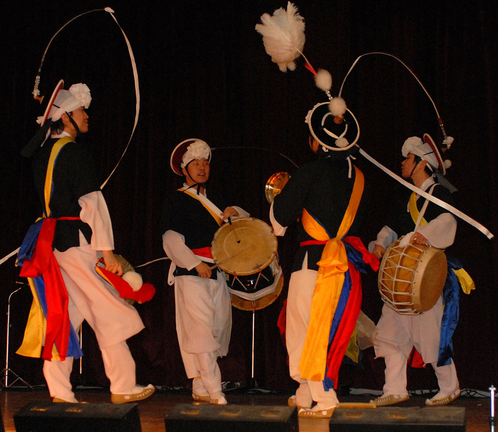 KUNSAN AIR BASE, South Korea -- The Gwang Dae performance group from Gunsan City performs for Airmen here Dec. 28.  The group performed as part of Kunsan’s Good Neighbor Program and gave Airmen a chance to learn about Korean music and culture.  (U.S. Air Force photo/Senior Airman Giang Nguyen)