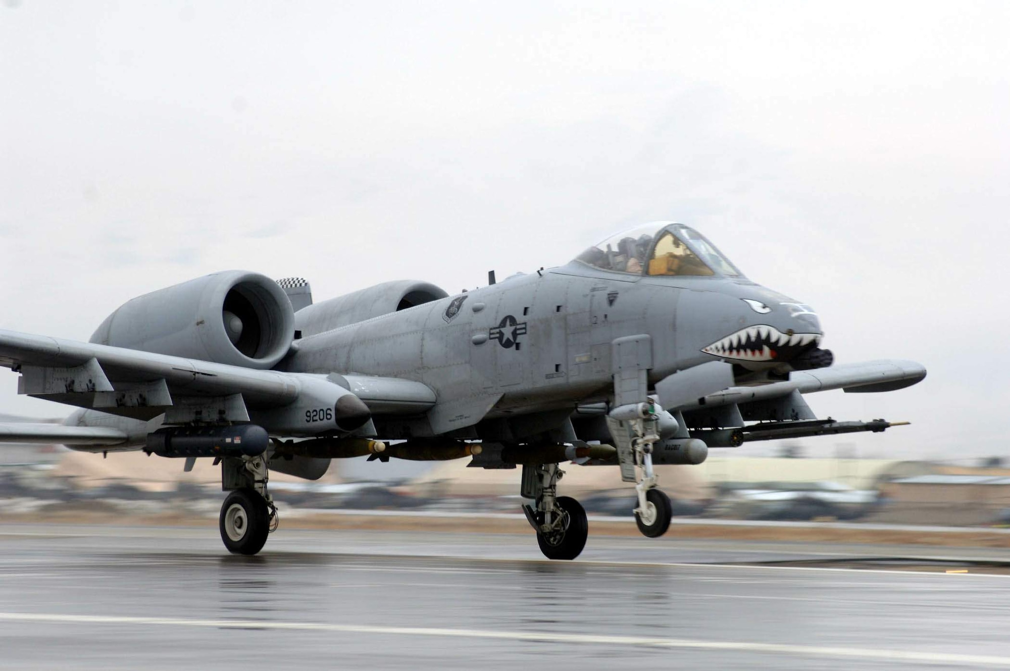 An A-10 Thunderbolt II lands after a recent mission. A-10s can employ a wide variety of conventional munitions, including general purpose bombs, cluster bomb units, laser guided bombs, joint direct attack munitions, wind corrected munitions dispenser or WCMD, AGM-65 Maverick and AIM-9 Sidewinder missiles, rockets, illumination flares, and the GAU-8/A 30mm cannon. A-10s provide close-air support in Operation Enduring Freedom in Afghanistan. (U.S. Air Force photo/Tech. Sgt. Joseph Kapinos)
