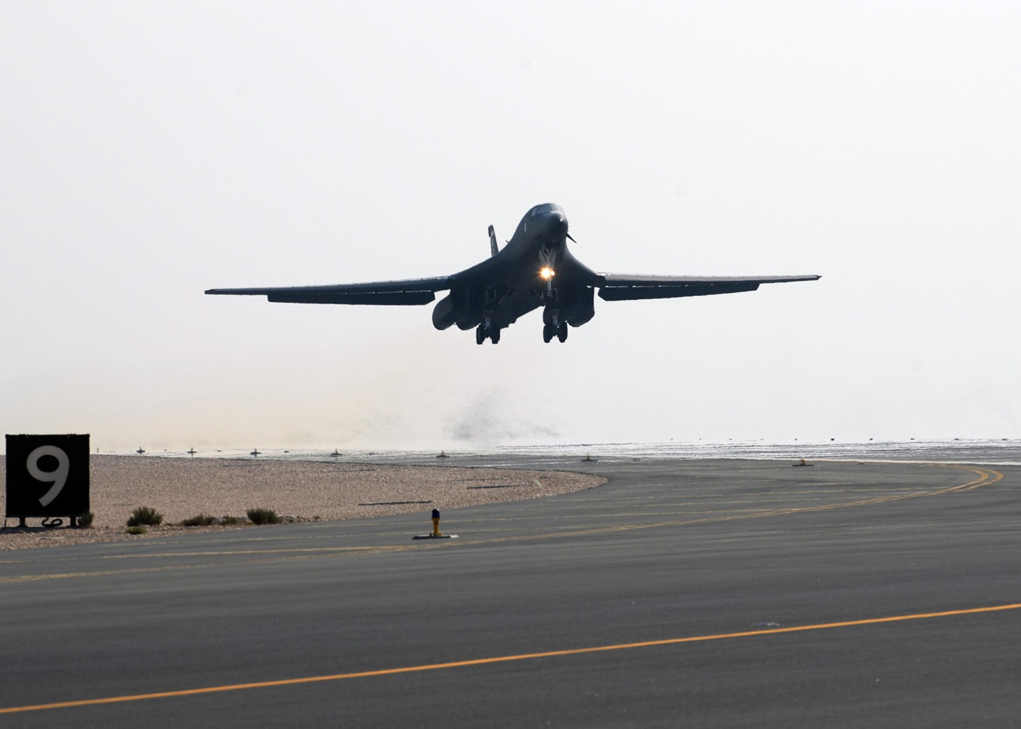SOUTHWEST ASIA - A mission-bound B-1B Lancer lifts off from the runway of a Southwest Asia air base  Dec.29. The B-1B is a multi-role, long-range bomber, capable of flying intercontinental missions without refueling. It is capable of performing a variety of missions, including that of carrying conventional weapons for theater operations. (U. S. Air Force photo/Staff Sgt. Douglas Olsen)