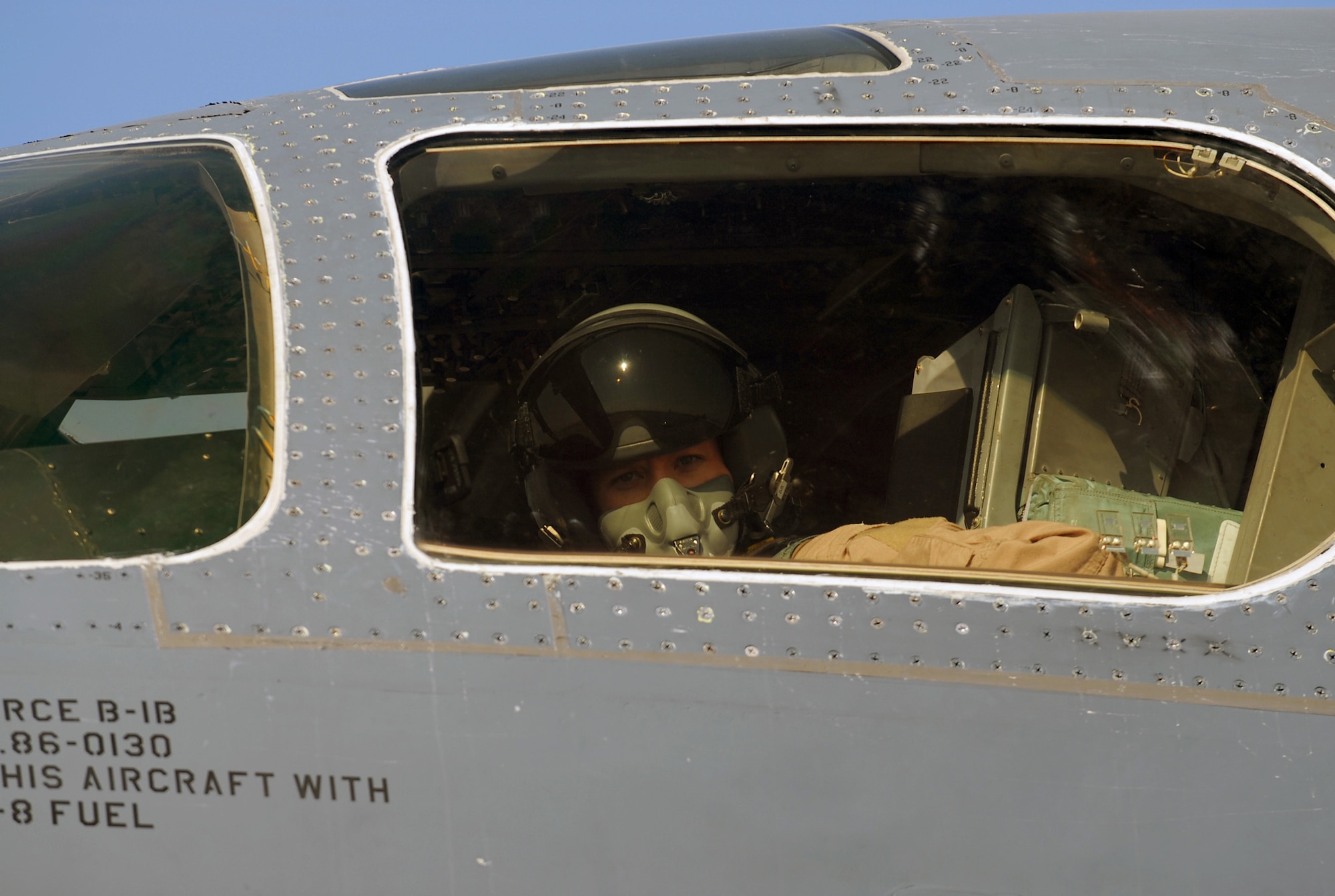 SOUTHWEST ASIA - Capt. Crystal Powers, 9th Expeditionary Bomb Squadron aircraft commander, settles into the pilot's seat of the B-1B Lancer bomber she will fly on a mission at a Southwest Asia air base Dec. 29. (U. S. Air Force photo/Staff Sgt. Douglas Olsen)