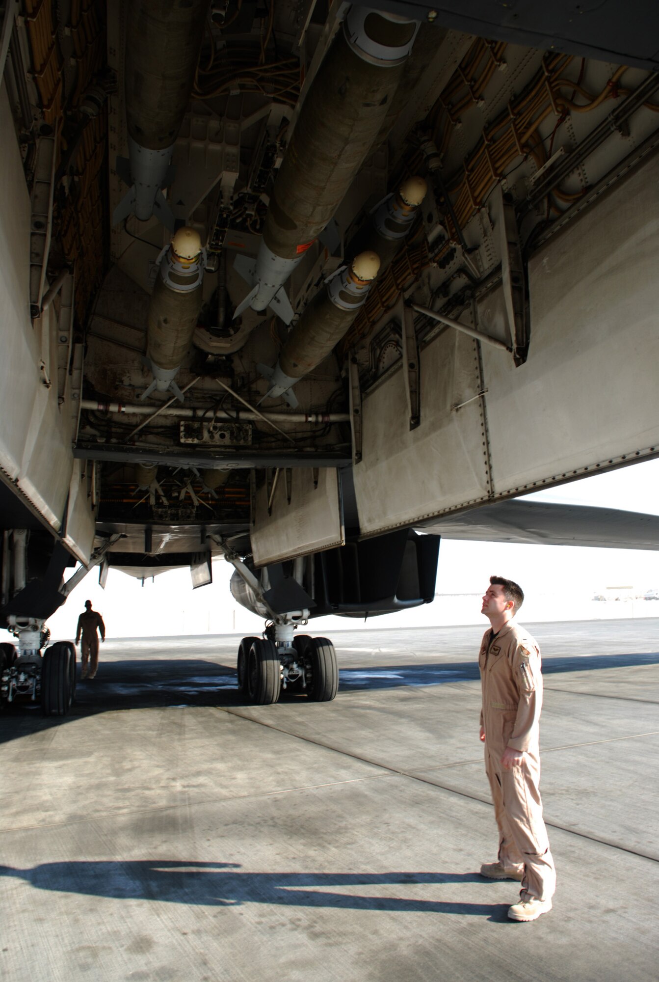 SOUTHWEST ASIA - 1st Lt. Jason Edwards, 9th Expeditionary Bomb Squadron, checks the bomb load of a  B-1B Lancer bomber as he and his comrades preflight the aircraft for a mission at a Southwest Asia air base Dec.29. (U. S. Air Force photo/Staff Sgt. Douglas Olsen)