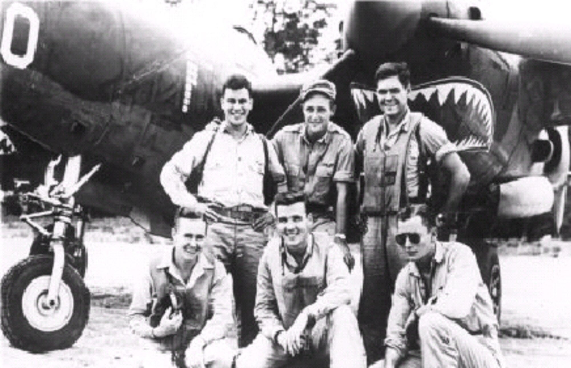 02/02/2007 -- MISAWA AIR BASE, Japan -- Aces of the 39th Fighter Squadron pose by a P-38 in 1943. In the front row, left to right are:  "Sully" O'Sullivan, Tommy Lynch and Ken Sparks. In the back row, left to right are: Dick Suehr, "Shady" Lane and Stan Andrews. (U.S. Air Force photo)