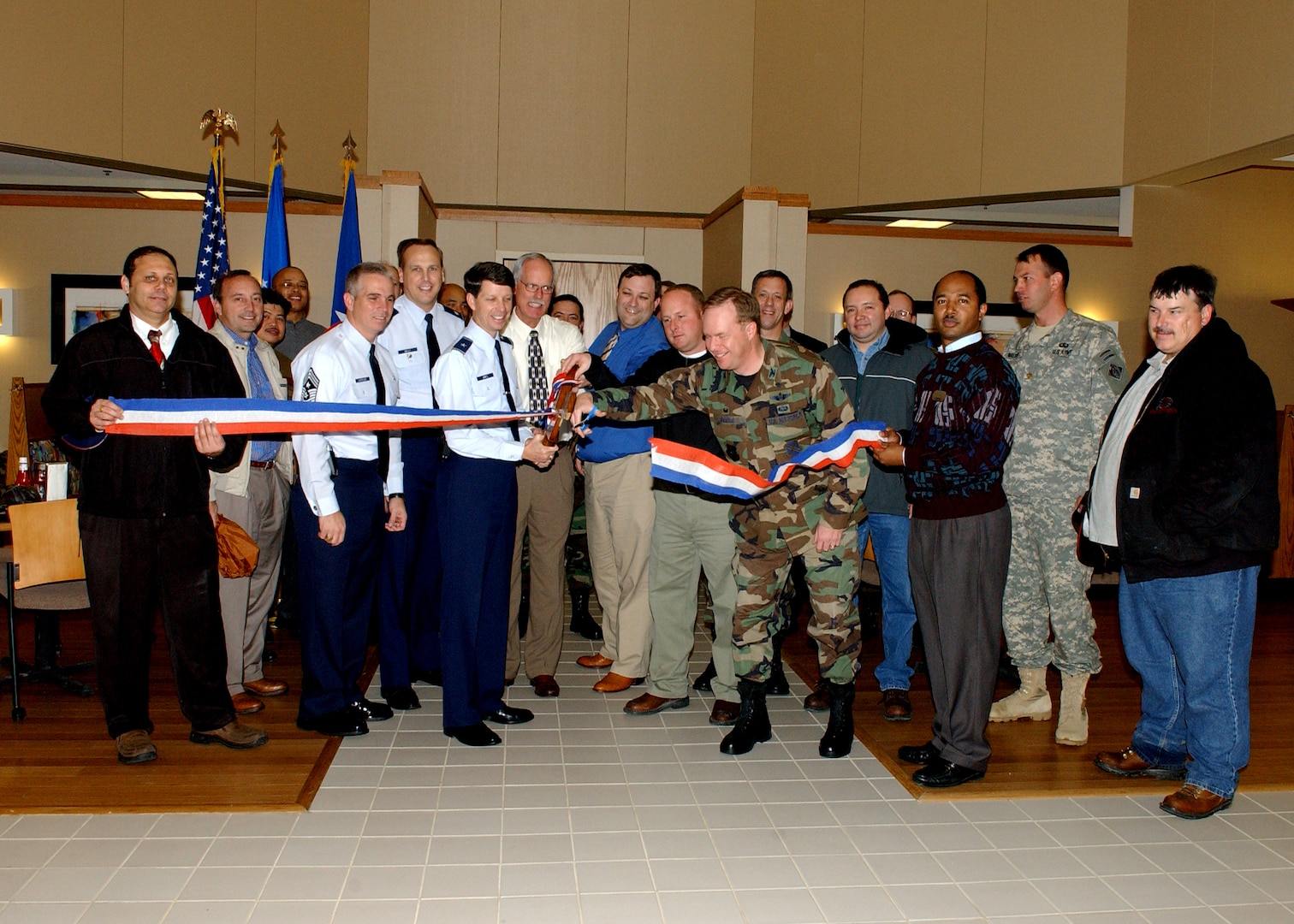 37th Training Wing and Services Division leadership, lead by Brig. Gen. Darrell Jones, then the 37th TRW commander, gather for the ceremonial ribbon cutting Jan. 24, 2007, at the new dining facility on the Lackland Training Annex at Lackland Air Force Base, Texas. (USAF photo by Alan Boedeker)                               