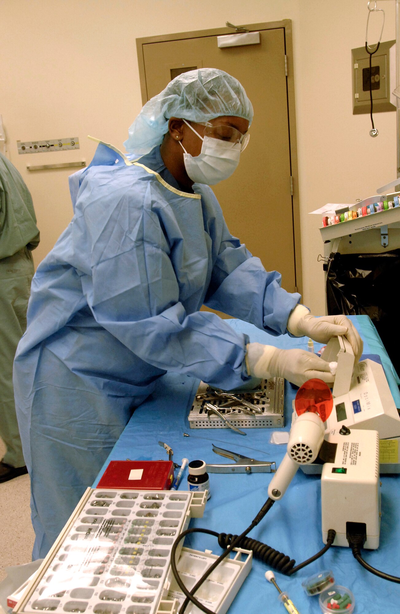 Staff Sgt Tiawanna West sorts dental instruments and prepares them for sterilization after assisting in a dental rehabilitation surgery Jan. 29 Aviano Air Base, Italy. Sergeant West is a surgery technician with the 31st Dental Squadron. The 31st DS provides services for more than 10,000 members and their families. (U.S. Air Force photo/Airman 1st Class Liliana Moreno)
