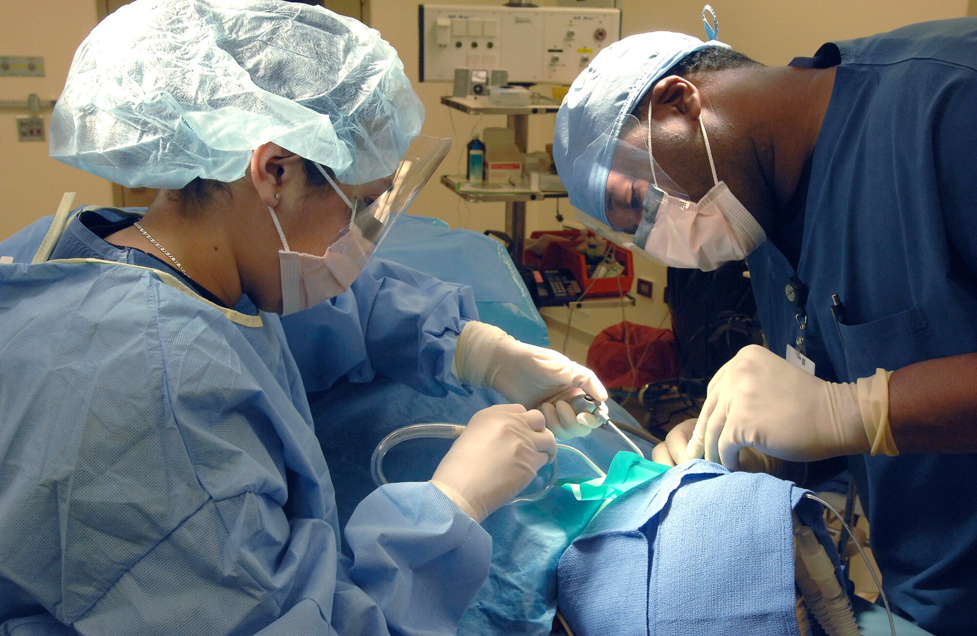 Senior Airman Sarai Gapetz, and Capt. Corbet Ellison perform a dental rehabilitation surgery Jan. 29 at Aviano Air Base, Italy. Airman Gapetz is a dental technician and Captain Ellison is a pediatric dentist, and both are assigned to the 31st Dental Squadron. The 31st DS provides services for more than 10,000 members and their families. (U.S. Air Force photo/Airman 1st Class Liliana Moreno) 
