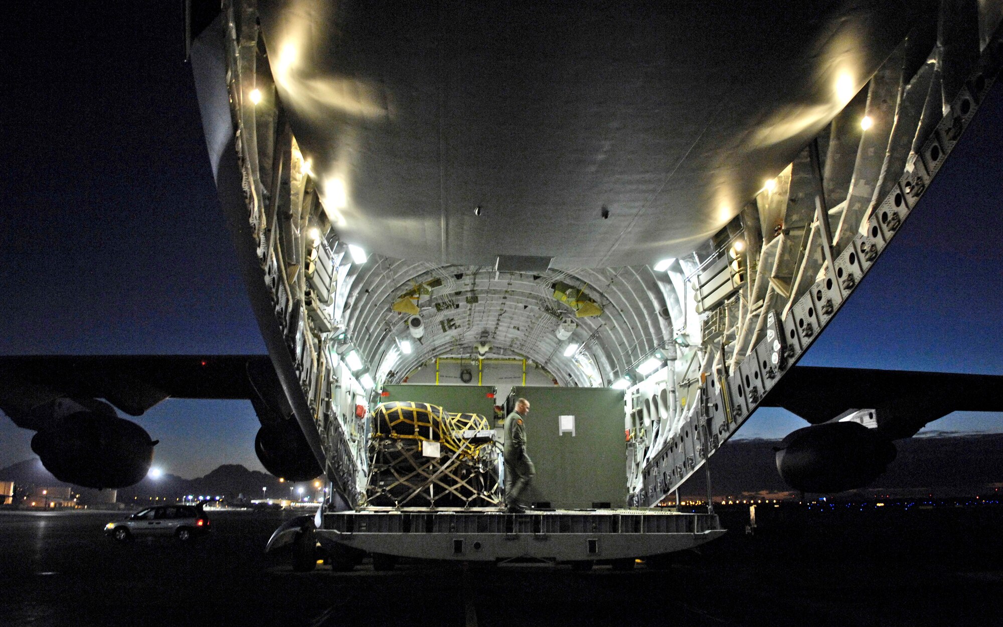 Staff Sgt. Jason Scaffidi conducts a final check of equipment loaded on a C-17 Globemaster III Jan. 25 at Hickam Air Force Base, Hawaii. Sergeant Scaffidi is a loadmaster with the 535th Airlift Squadron. The C-17 can take off and land on runways as short as 3,500 feet and only 90 feet wide. Even on such narrow runways, the C-17 can turn around using a three-point star turn and its backing capability. (U.S. Air Force photo/Tech. Sgt. Shane A. Cuomo) 
