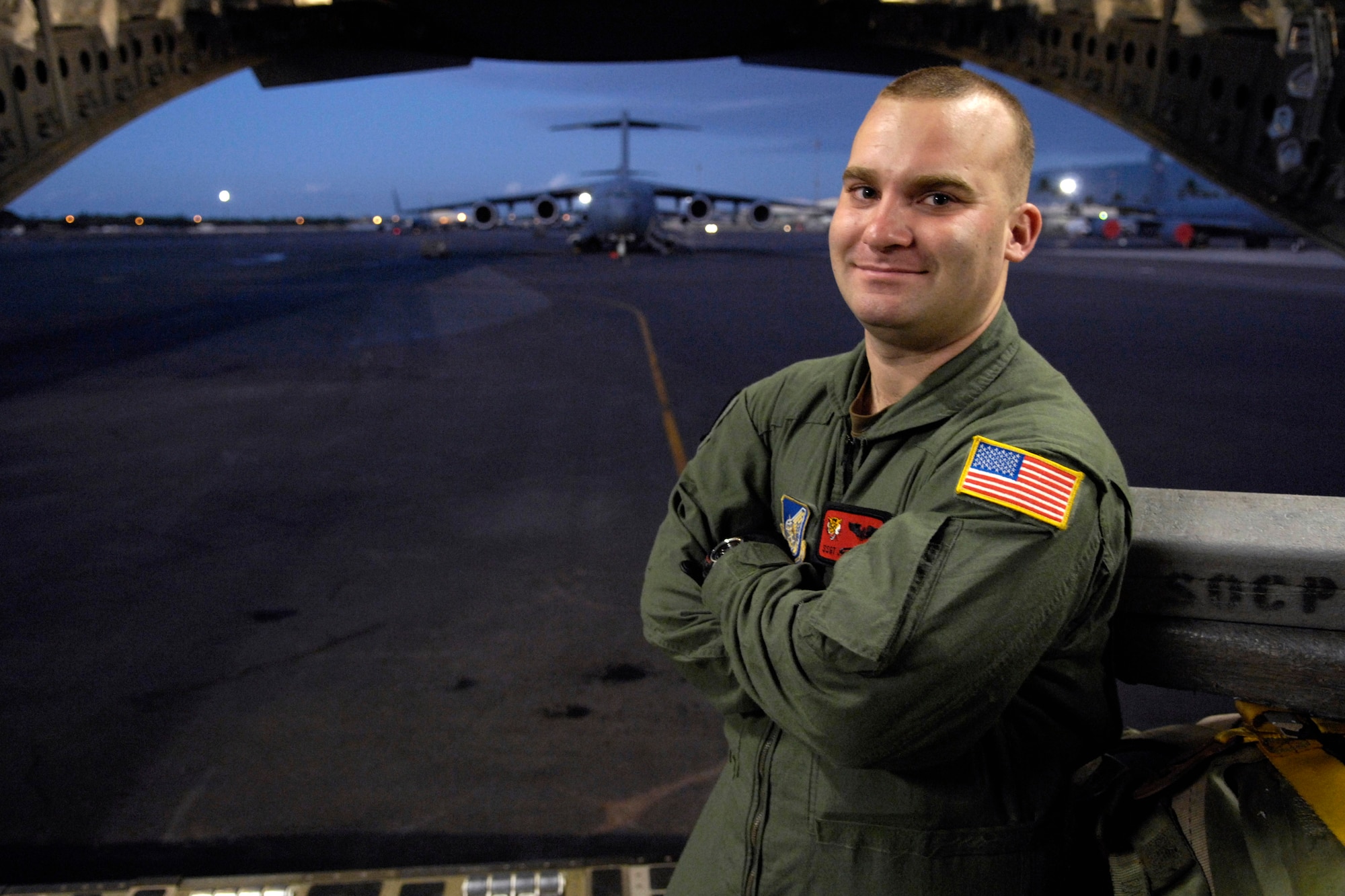 Staff Sgt. Jason Scaffidi is a C-17 Globemaster III loadmaster with the 535th Airlift Squadron. The aircraft can perform tactical airlift and airdrop missions and can also transport litters and ambulatory patients during aeromedical evacuations when required. (U.S. Air Force photo/Tech. Sgt. Shane A. Cuomo) 
