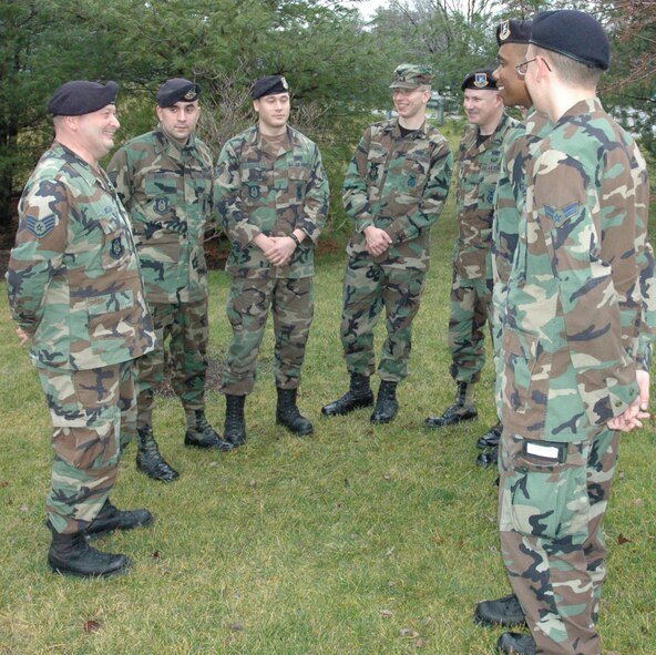 YOUNGSTOWN AIR RESERVE STATION, Ohio—Members of the 910th Security forces Squadron enjoy being in their element- outdoors.  Air Force Reserve Staff Sgt. Edward L. McLean (left) discusses with the group the living conditions at Patriot Defense pre-deployment training to that of their temporary home at Kirkuk AB where they will be deploying later this month.  
