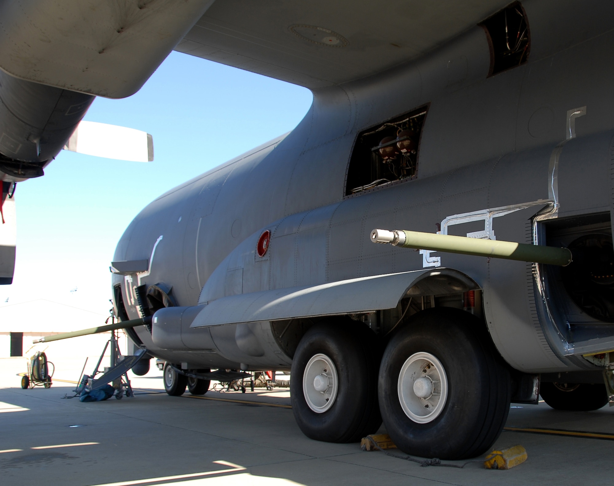 Armed and dangerous - Bushmaster 30 mm cannons protrude from the gunports of an AC-130U Spooky gunship during tests at Hurlburt Field, Fla.  The 30 mm gun will eventually replace both the 40 mm cannon and 25 mm gun on U-model gunships. (Air Force photo by Chief Master Sgt. Gary Emery)   