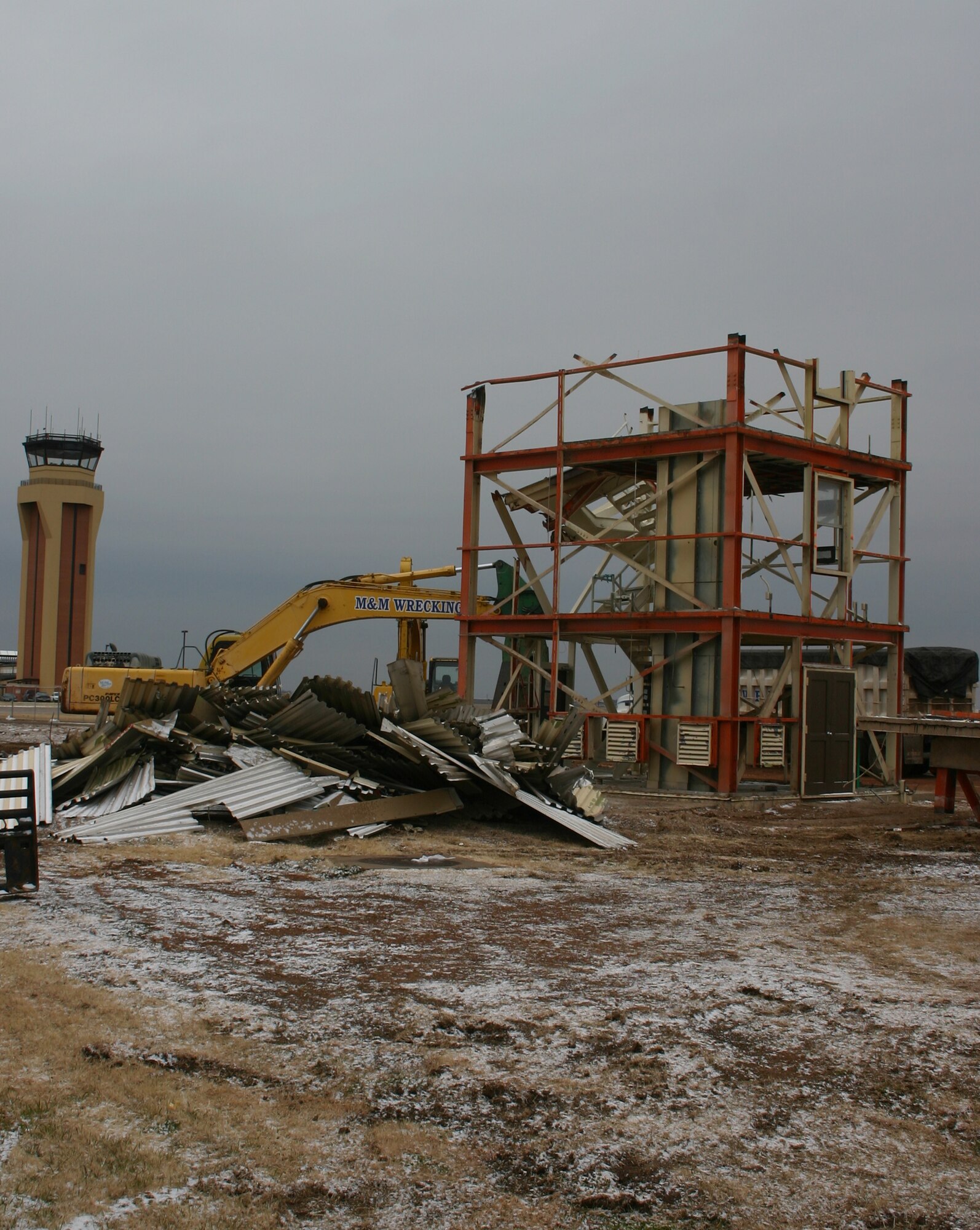 Only the lower framework remains of the old control tower that stood next to Bldg. 1093, while the new tower stands ready for operation just a short distance away. (U.S. Air Force Photo/SSgt Tonnette Thompson)