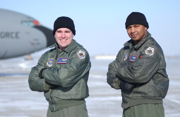 GRAND FORKS AIR FORCE BASE, N.D. -- Captain Justin Hendricks (left) and Captain Sheroyd Brown, both instructor pilots with the 319th Operations Support Squadron, show off their newly earned Air Force Weapons School patches.  As tow of the wing's five weapons officers, the captains are responsible for training aircrews on advanced KC-135 tactics.  The school has 12 slots per year split between two sessions and culminates in a massive exercise involving more than 80 aircraft including 30 aggressor aircraft. (U.S. Air Force photo/Senior Airman J. Paul Croxon)