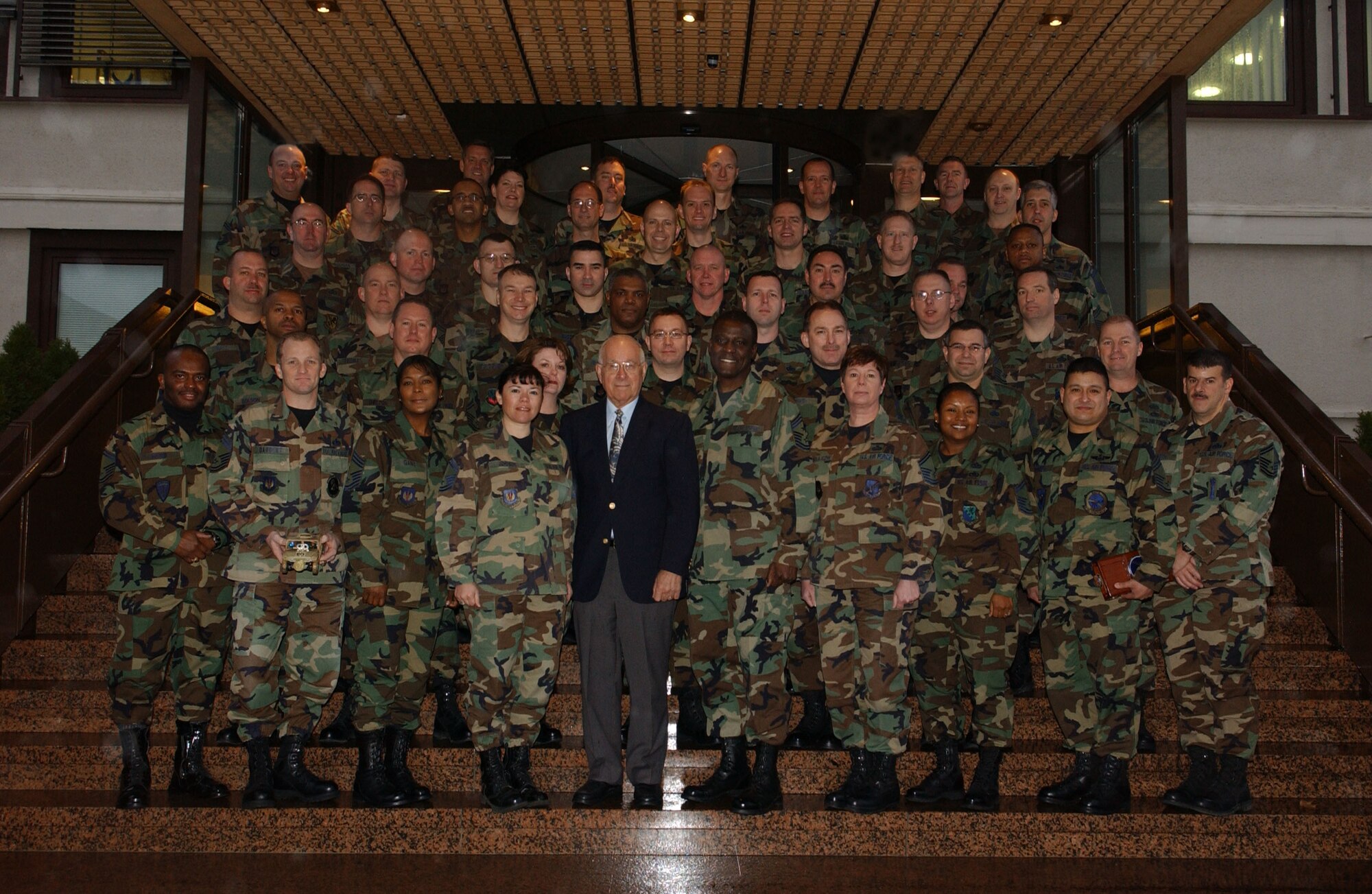 Retired Chief Master Sgt. of the Air Force Sam E. Parish (wearing suit) stands beside U.S. Air Forces in Europe Command Chief Master Sgt. Gary G. Coleman and members of the Chiefs Orientation class held at Ramstein Air Base, Germany. (U.S. Air Force photo/Airman 1st Class Amber Bressler)