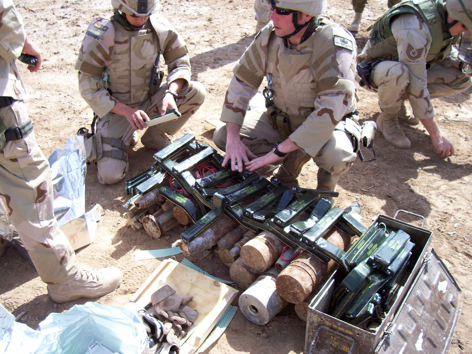 While deployed, Staff Sgt. Howie Loughran, 31st Civil Engineer Squadron EOD team leader, shows different types of explosive devices to team members.   (Photo courtesy of 31st Civil Engineer Squadron)
