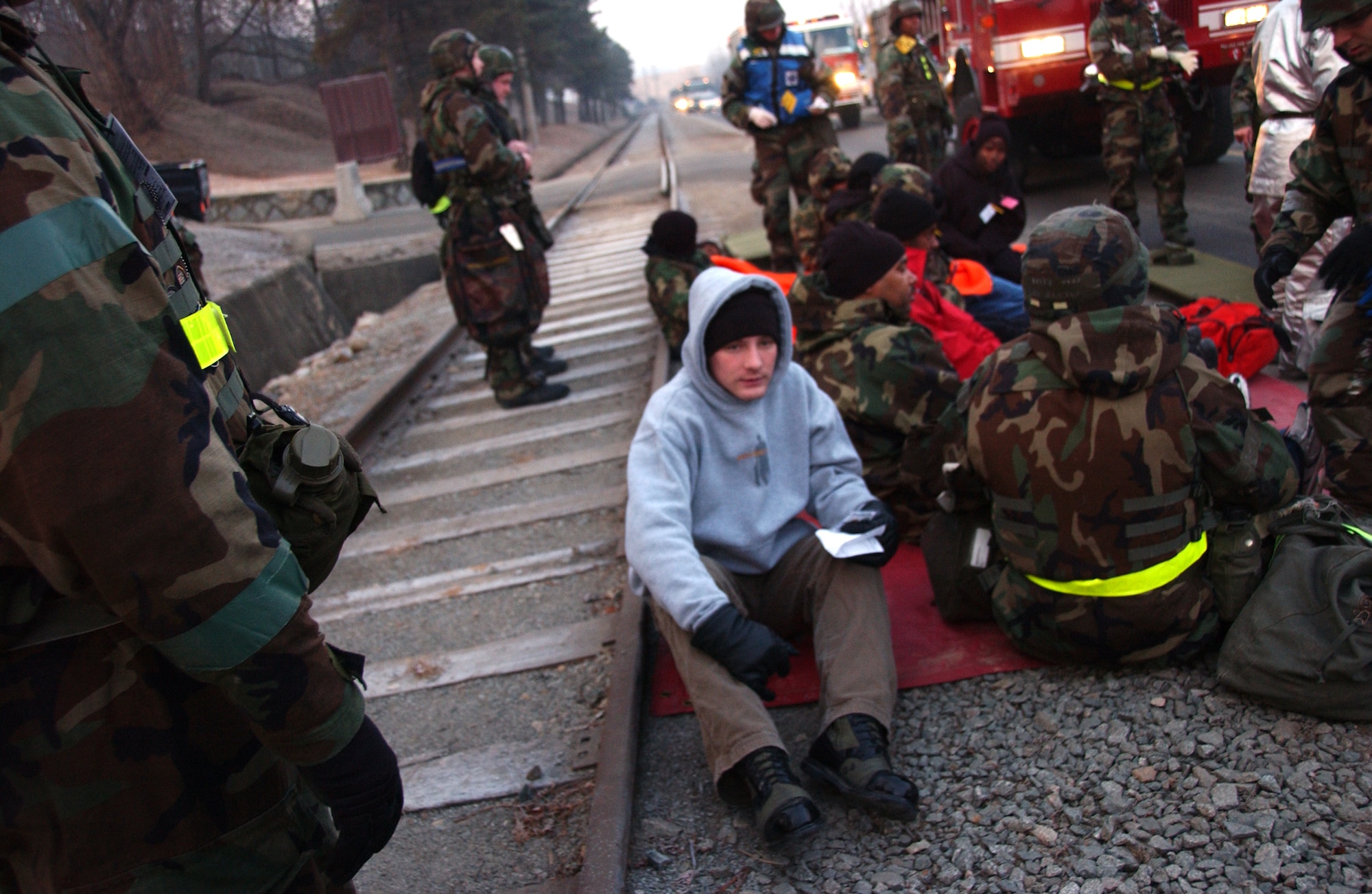 OSAN AIR BASE, Republic of Korea --  Simulated wounded lie in pain during an “attack” on Osan Jan. 23. The exercise scenarios tested Team Osan's ability to defend the base and conduct daily operations in a combat environment. (U.S. Air Force photo by Airman 1st Class Chad Strohmeyer)