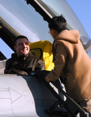 KUNSAN AIR BASE, Republic of Korea Jan. 19, 2007 -- First Lt. Brian Moore, 35th Fighter Squadron ?Panton? F-16 pilot, gives a local Korean student an up-close look at the flight controls of his fighter. More than 50 of the English students visited the base Jan. 19 to get a look at some of the Wolf Pack?s missions, sharper their English-speaking skills and learn how to use American currency.