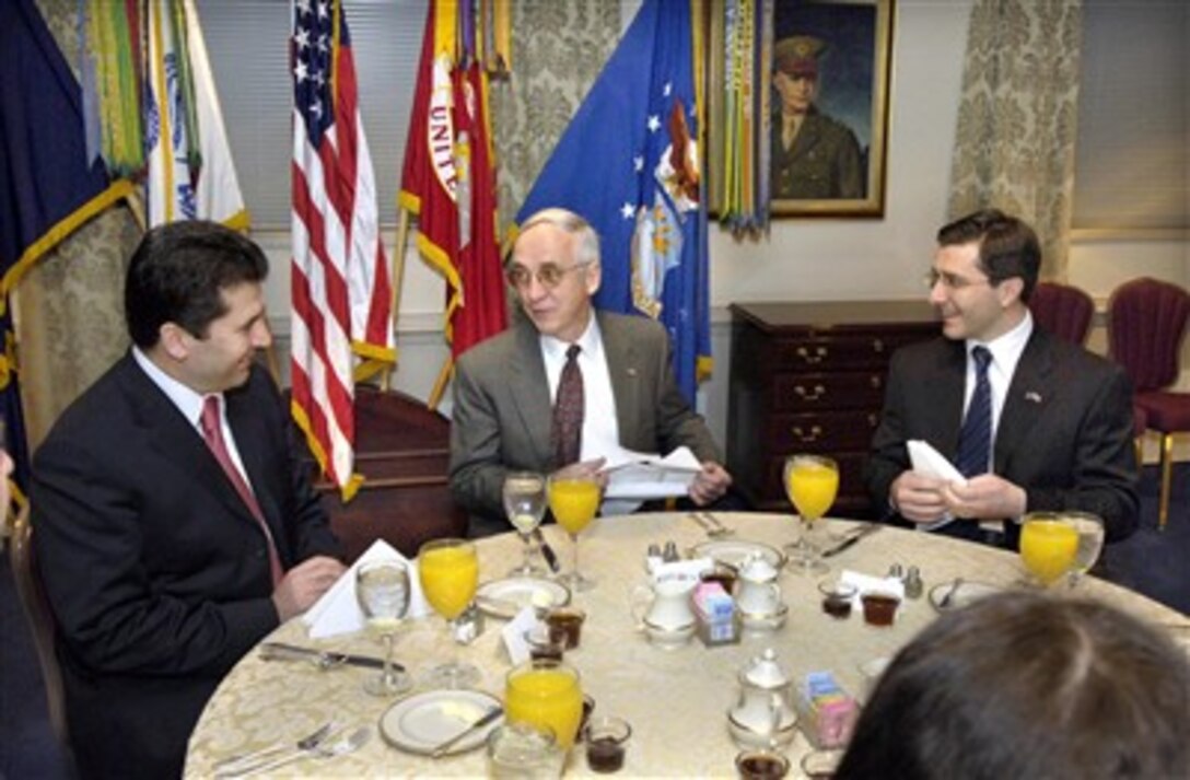 Deputy Secretary of Defense Gordon England (center) hosts a breakfast meeting with Albanian Minister of Defense Fatmir Mediu (left) and Macedonian Lazar Elenovski (right) in the Pentagon on Jan. 31, 2007.  A range of regional security issues is being discussed.  