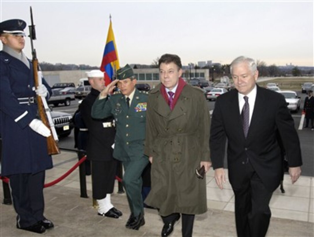 Secretary of Defense Robert M. Gates (right) escorts Colombian Minister of National Defense Juan Manuel Santos (2nd from right) and Chief of the Colombian Defense Staff Gen. Freddy Padilla (3rd from right) through an honor cordon and into the Pentagon on Feb. 1, 2007.  Gates will host a working breakfast for the Colombian delegation to discuss a broad range of bilateral security issues.  